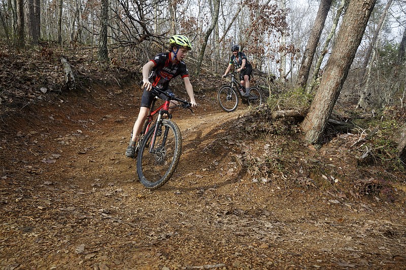 Charlie Babcock, right, and his son Jacob bike at Stringer's Ridge Park on Sunday, Dec. 27, 2015, in Chattanooga, Tenn.