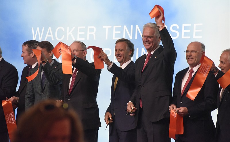 Wacker Wacker supervisory board chairman Peter-Alexander Wacker holds a piece of ribbon over his head during a grand opening ceremony for the company's new $2.5 billion plant on Monday, Apr. 18, 2016, in Charleston, Tenn. Tennessee Governor Bill Haslam stands to his left, while Dr. Rudolf Staudigl (CQ), president and CEO of Wacker Chemie, stands to his right. 