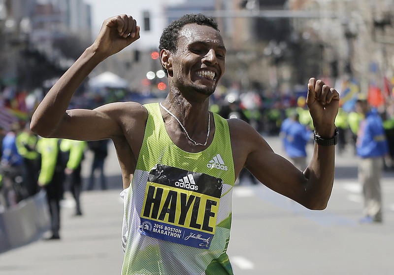 Lemi Berhanu Hayle, of Ethiopia, celebrates after winning the 120th Boston Marathon on Monday, April 18, 2016, in Boston. (AP Photo/Elise Amendola)