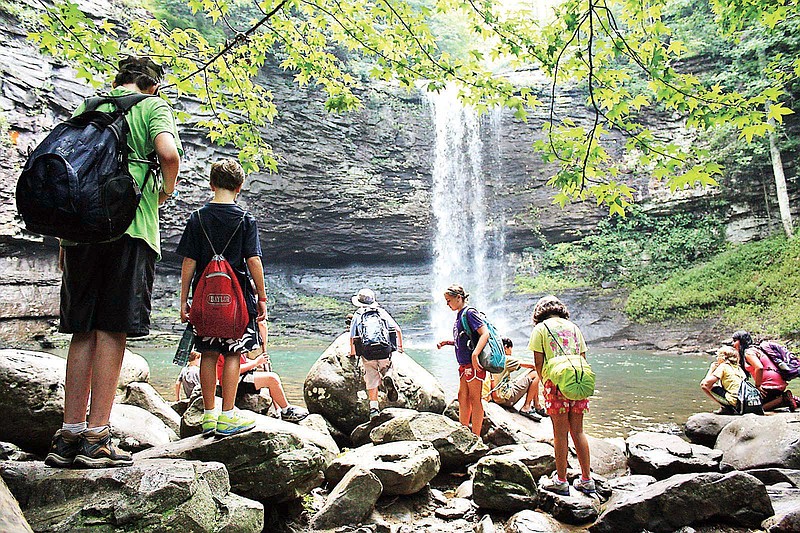 Campers explore the shore area by one of Cloudland Canyon's waterfalls. Outdoor enthusiasts and GIS experts are gathering at Outdoor Chattanooga on Thursday to collaborate on an app that will map the area's outdoor recreations offerings in a cohesive, central database accessible for all.