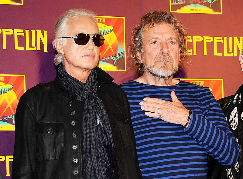 In this Oct. 9, 2012, file photo, members of Led Zeppelin, guitarist Jimmy Page, left, and singer Robert Plant appear at a press conference ahead of the worldwide theatrical release of "Celebration Day", a concert film of their 2007 London O2 arena reunion show, in New York. A federal judge in Los Angeles ruled Friday, April 8, 2016, that a copyright infringement lawsuit over the Led Zeppelin song "Stairway to Heaven" should be decided at trial. A trustee of late songwriter-guitarist Randy Wolfe sued the band claiming "Stairway to Heaven" copies the opening notes of a song created by Wolfe in the late 1960s.