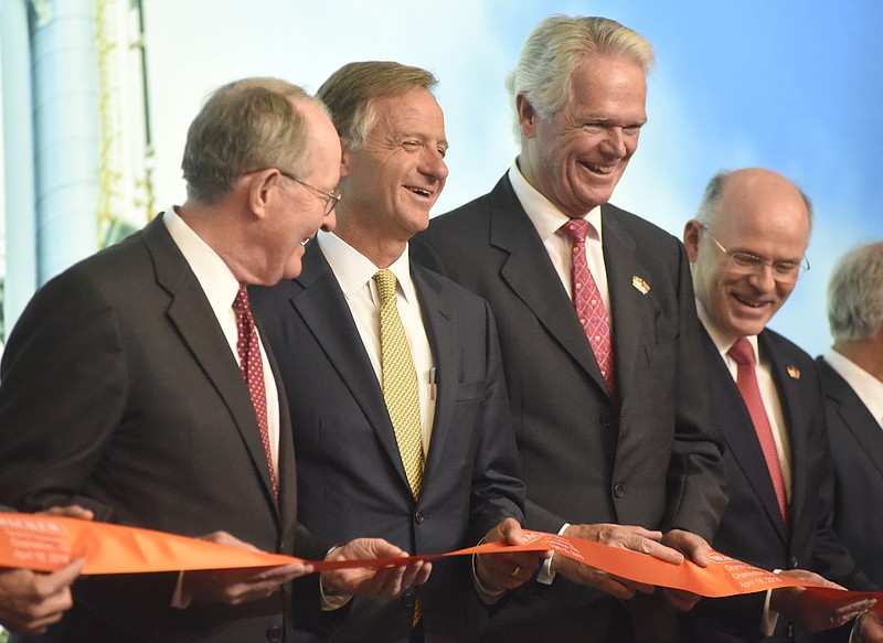 U. S. Senator Lamar Alexander, Tennessee Governor Bill Haslam, Wacker supervisory board chairman Peter-Alexander Wacker and Dr. Rudolf Staudigl (CQ), president and CEO of Wacker Chemie, from left, hold a ribbon as Wacker hosts a press briefing and grand opening ceremony for their new $2.5 billion plant this week. Wacker has helped lead metro Cleveland to become the fastest metro area for job growth in the past year, according to the U.S. Bureau of Labor Statistics.