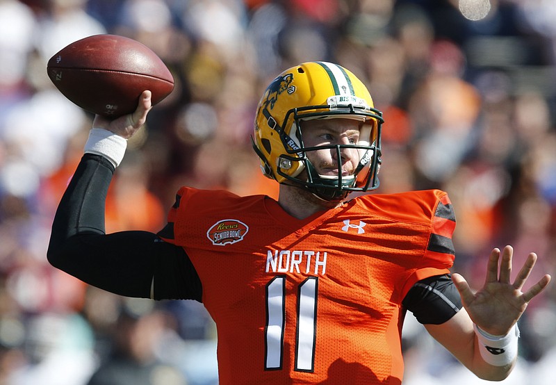 
              FILE - In this Jan. 30, 2016, file photo, North Dakota State quarterback Carson Wentz throws a pass during the Senior Bowl NCAA college football game at Ladd–Peebles Stadium, in Mobile, Ala. The Philadelphia Eagles acquired the No. 2 overall pick in next week's draft from the Cleveland Browns in exchange for five picks on Wednesday, April 20, 2016. The trade allows Philadelphia to select one of the top quarterback prospects, Carson Wentz of North Dakota State or Jared Goff of California at No. 2. (AP Photo/Brynn Anderson, File)
            