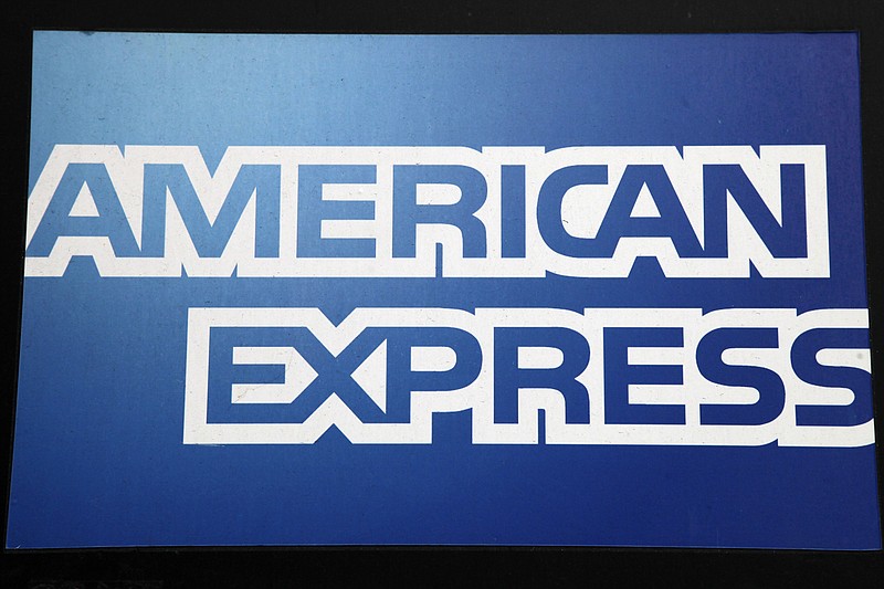 
              FILE - This Jan. 21, 2015, file photo, shows a sign for American Express outside a New York business. American Express reports financial results, Wednesday, April 20, 2016. (AP Photo/Mark Lennihan, File)
            