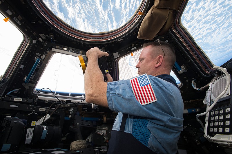 NASA Commander Barry Butch Wilmore using an IMAX camera aboard the International Space Station. (photo courtesy of NASA)