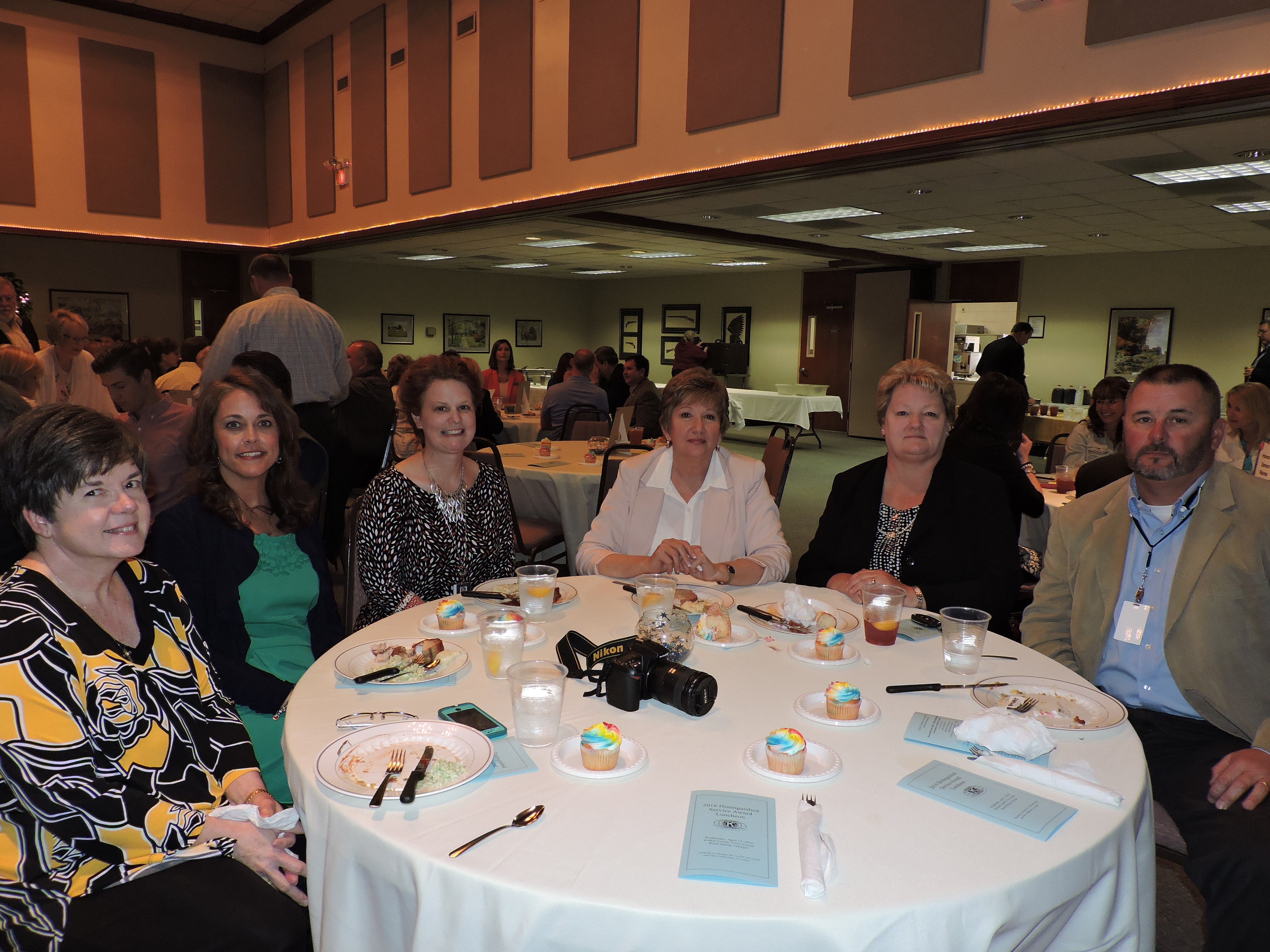 Walker County Schools officials turn out to congratulate Superintendent Damon Raines. From left are Schools Nutrition Coordinator Michelle Coker, Director of Curriculum and Instruction Robin Samples, Personnel Director Heather Holloway, school board members Phyllis Hunter and Karen Stoker, and Facilities Director Chris Jones.
