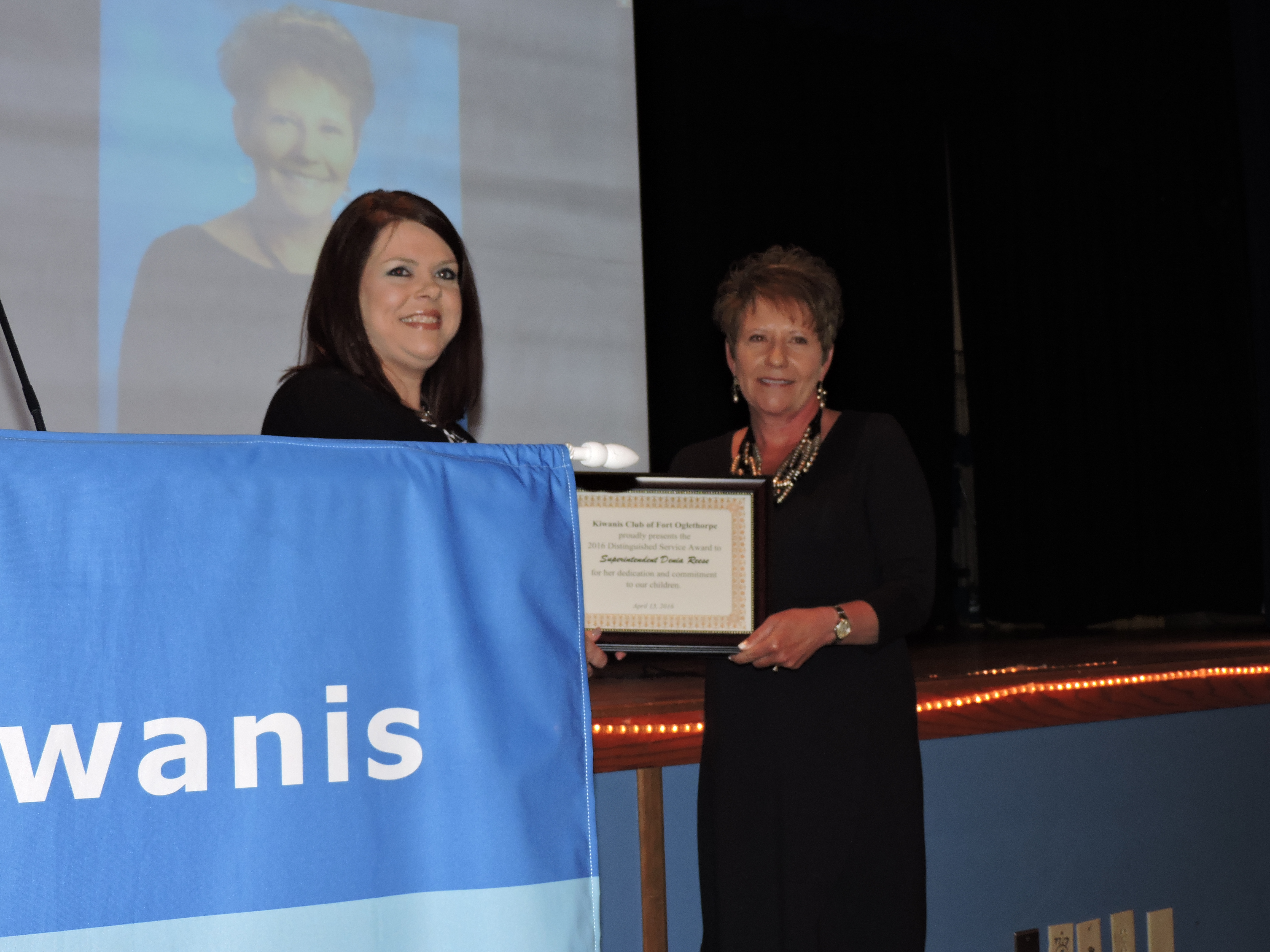 Fort Oglethorpe Kiwanis Club President Alice Holsopple, left, presents a Distinguished Service Award to Catoosa County Schools Superintendent Denia Reese.