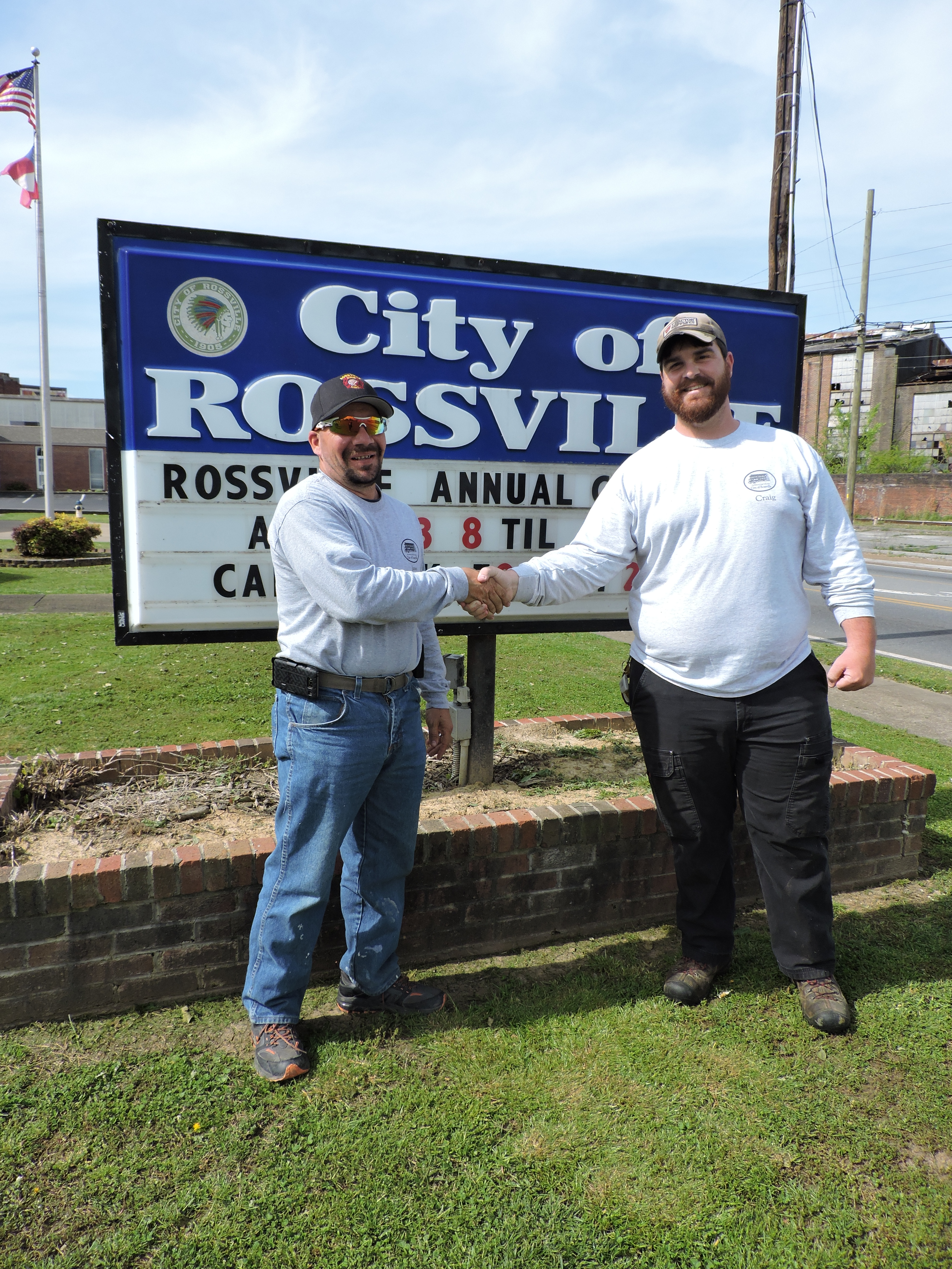 Rossville Public Works Department's James White, left, shakes hands with Craig Sylar as they get ready for the April 23 Cleanup Day.