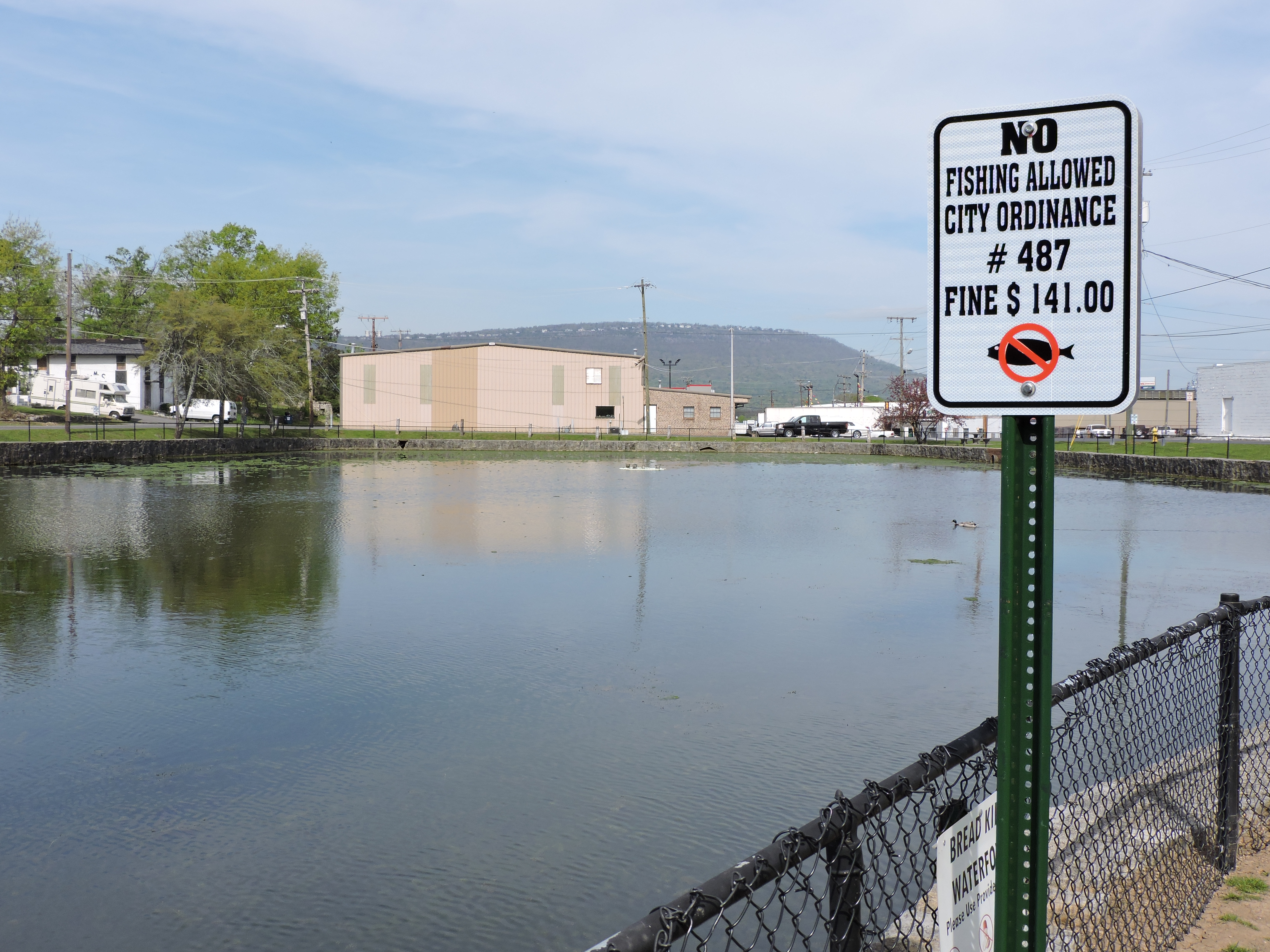 This sign at the Rossville Duck Pond alerts residents of a new ban on fishing there.