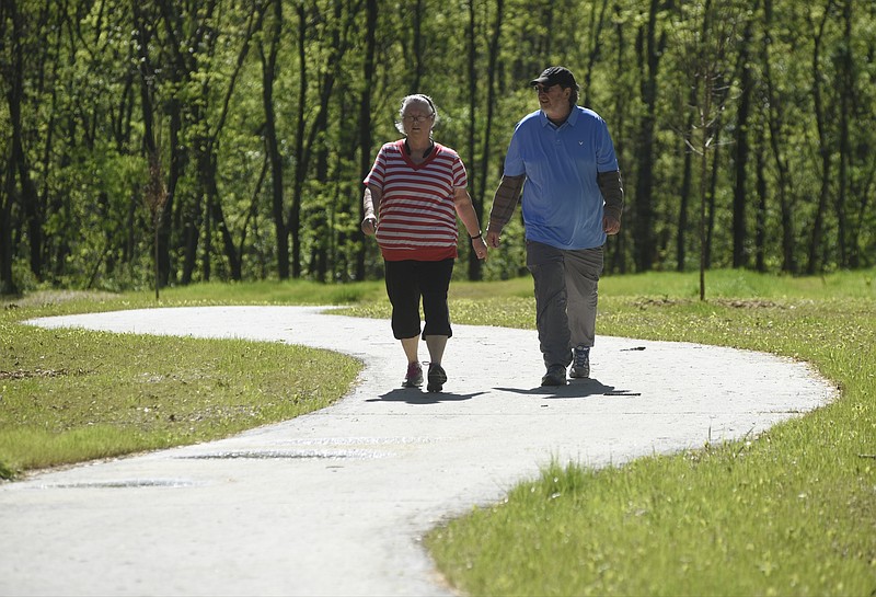 Debbie and Steve Burnette walk along the newly completed portion which connects the Tennessee Riverwalk with the rest of the greenway along South Chickamauga Creek and beyond.