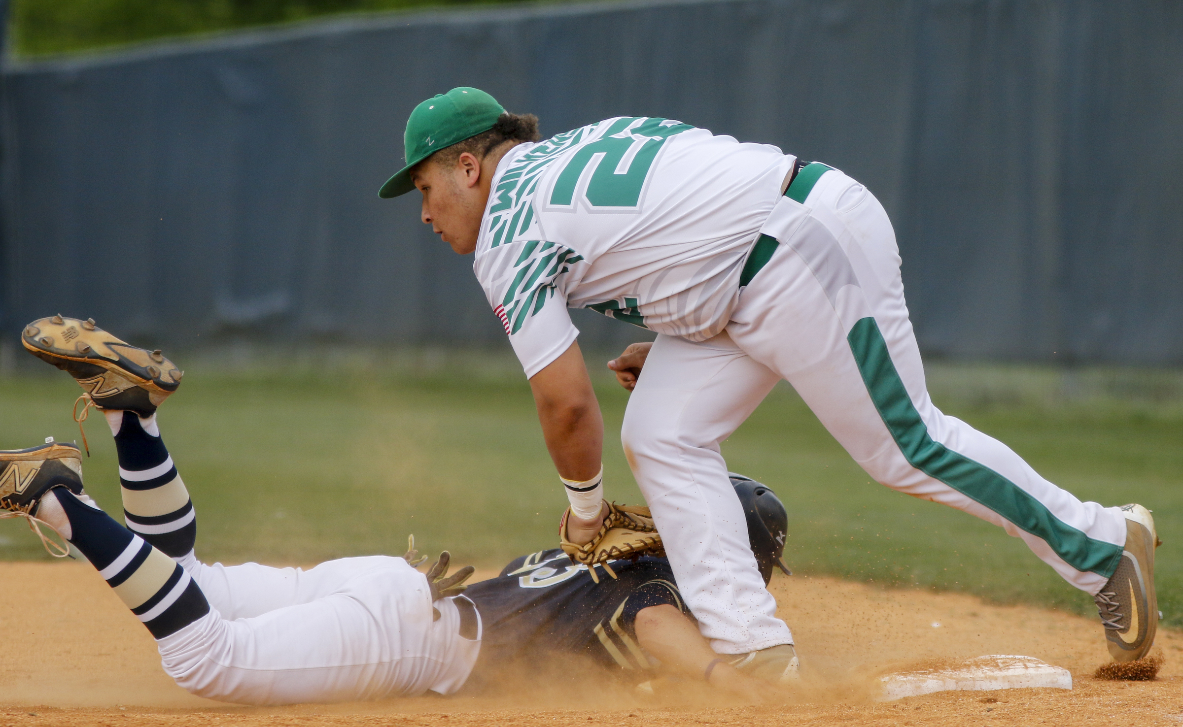 Rhea County 1st baseman Cameron Wilkerson tags Soddy-Daisy runner Chandler Sulcer as he dives back to 1st during their prep baseball game at Soddy-Daisy High School on Thursday, April 21, 2016, in Soddy-Daisy, Tenn.