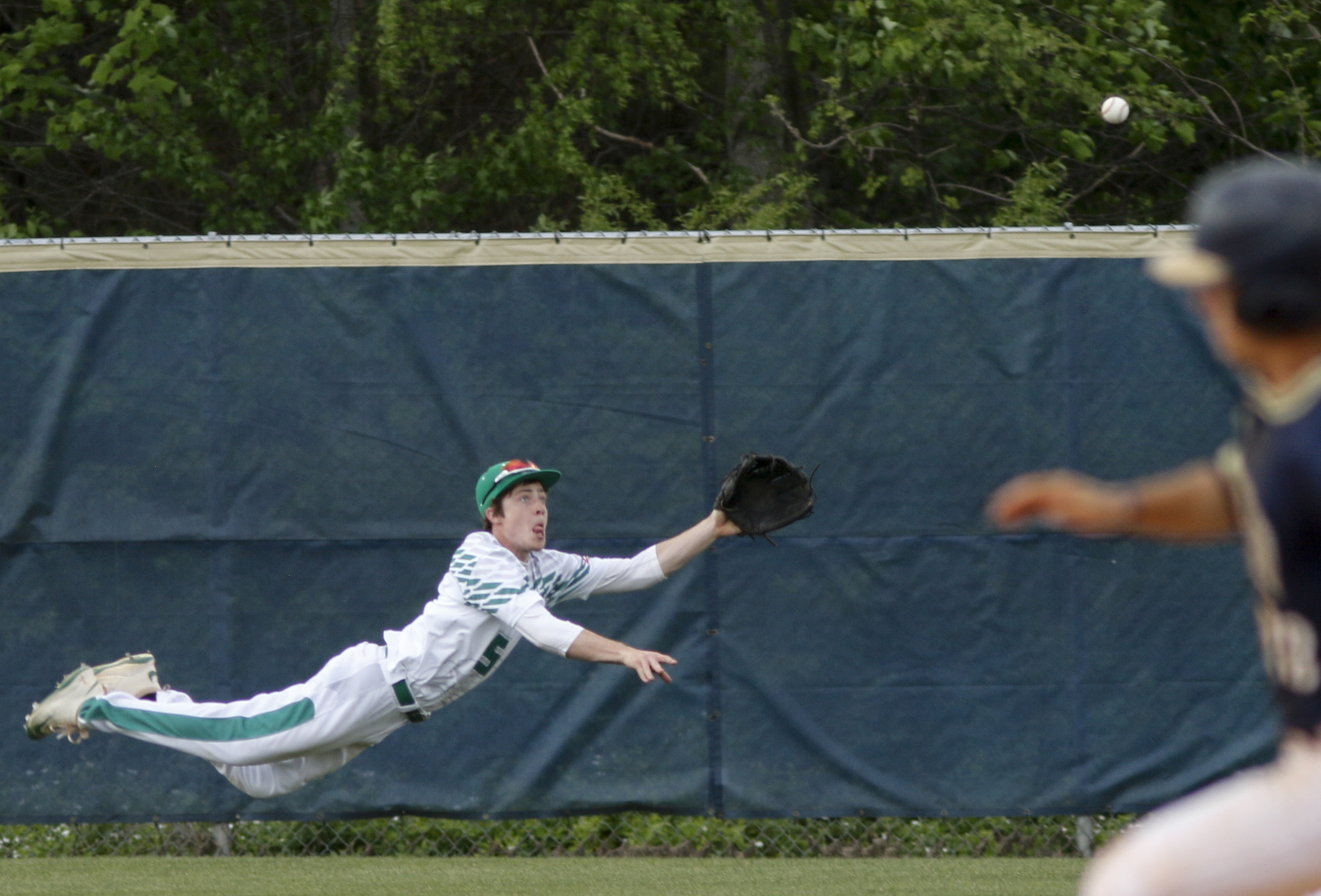 Rhea County center fielder Westin Ray makes a diving catch during their prep baseball game against Soddy-Daisy at Soddy-Daisy High School on Thursday, April 21, 2016, in Soddy-Daisy, Tenn.