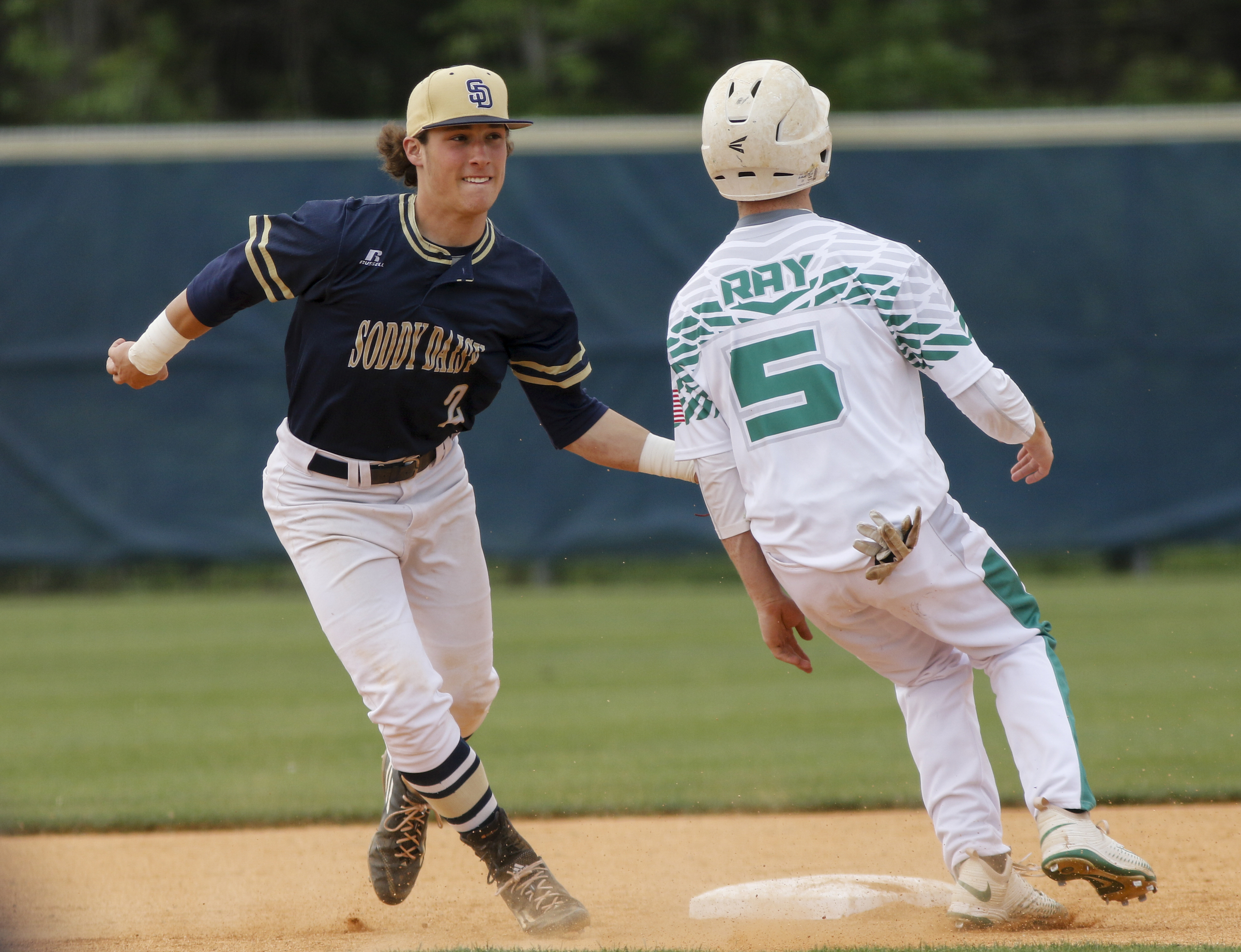 Soddy-Daisy shortstop Justin Cooke tags out Rhea County runner Westin Ray after running him down between 2nd and 3rd during their prep baseball game at Soddy-Daisy High School on Thursday, April 21, 2016, in Soddy-Daisy, Tenn.
