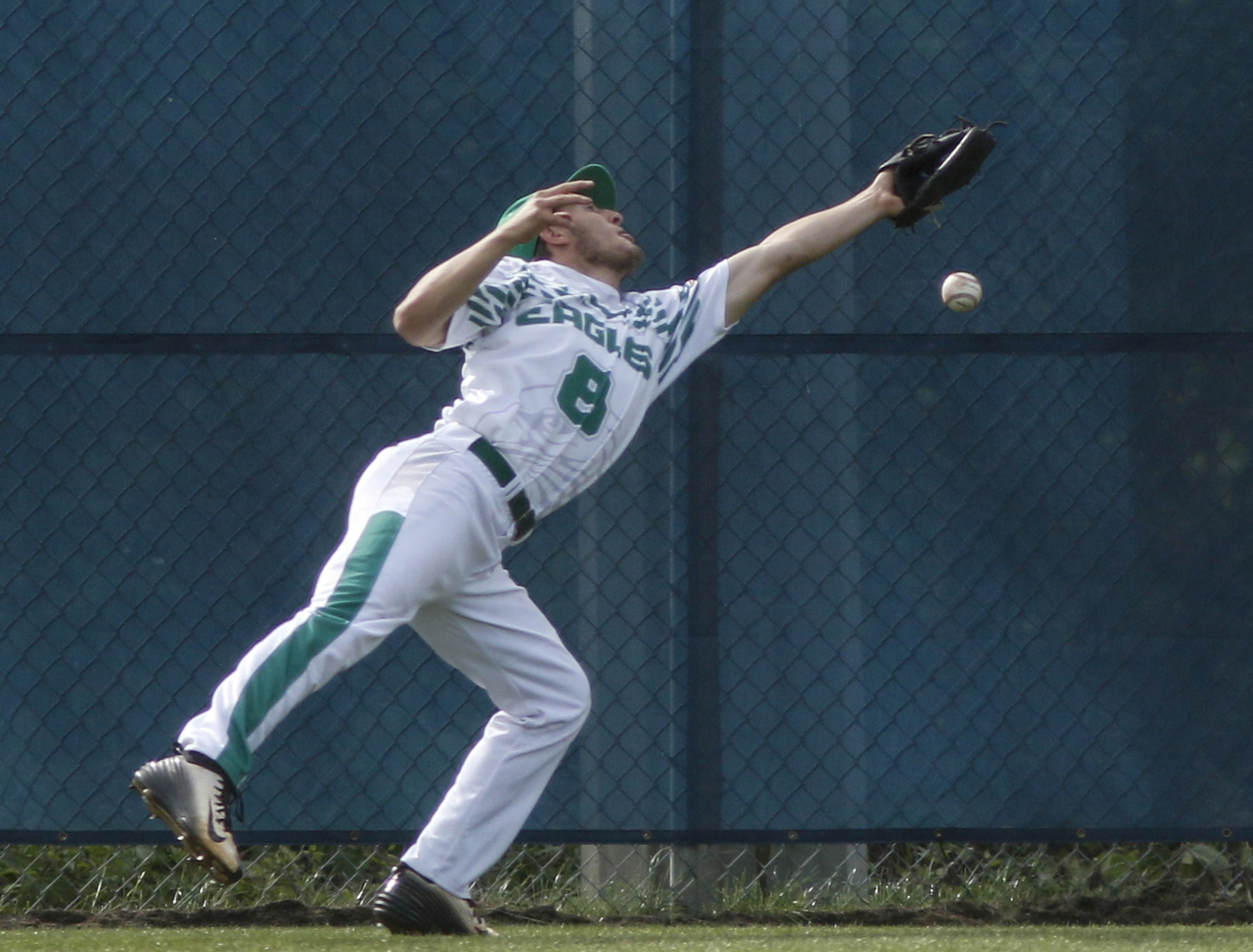 A long ball hit by Soddy-Daisy batter Gavin Rogers goes past Rhea County left fielder Travis Aikman during their prep baseball game at Soddy-Daisy High School on Thursday, April 21, 2016, in Soddy-Daisy, Tenn.