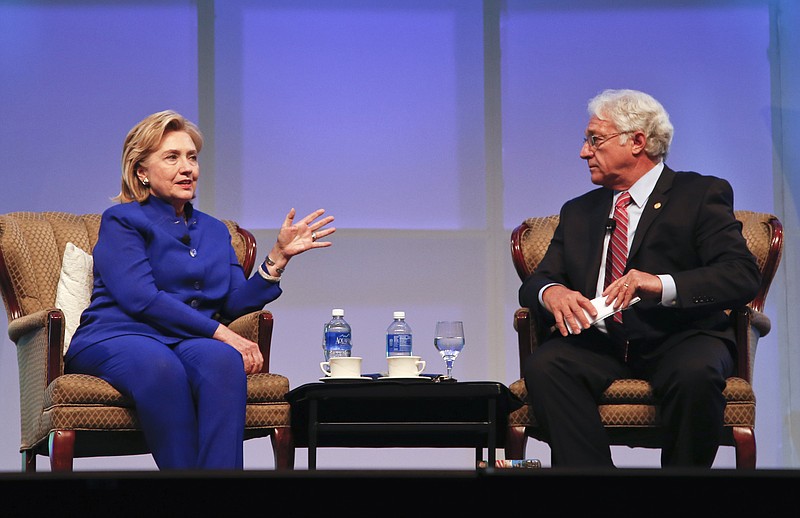 
              FILE - In this June 25, 2014 file photo, former Secretary of State Hillary Clinton speaks during a question and answer session with Jim Greenwood, President and CEO of the Biotechnology Industry Organization at the BIO International Convention in San Diego. An Associated Press review finds that most companies and groups that paid for speeches by Democratic presidential candidate Hillary Clinton lobbied federal agencies. More than one-third are government contractors. Their interests would follow Clinton to the White House should she win election this fall. (AP Photo/Lenny Ignelzi, File)
            