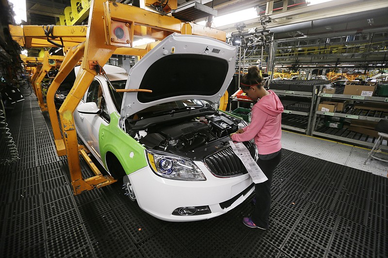 
              FILE - In this Monday, June 22, 2015, file photo, final trim is installed on a Buick Verano at the Orion Assembly in Orion Township, Mich. General Motors reports financial results Thursday, April 21, 2016. (AP Photo/Carlos Osorio, File)
            