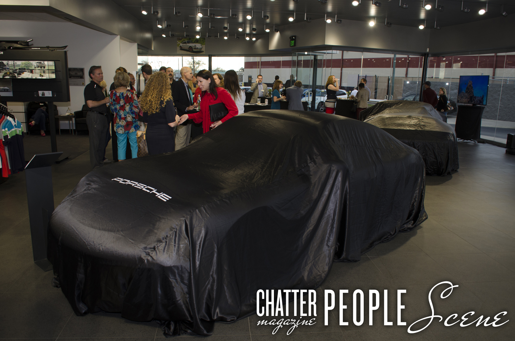 Patrons gather to see the unveiling of the 2017 Porsche 911
