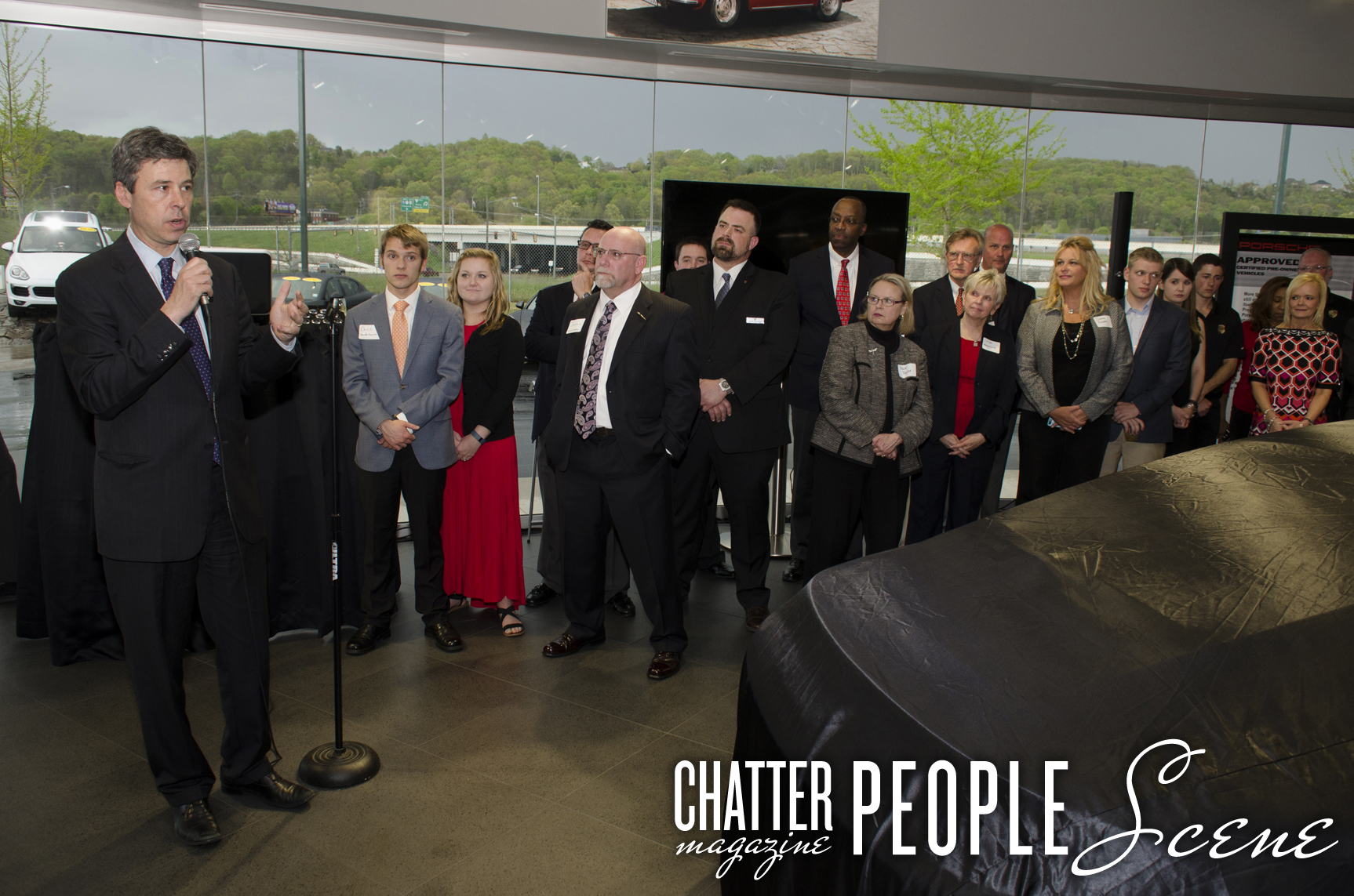 Mayor Andy Berke addresses the crowd while Porsche staff looks on