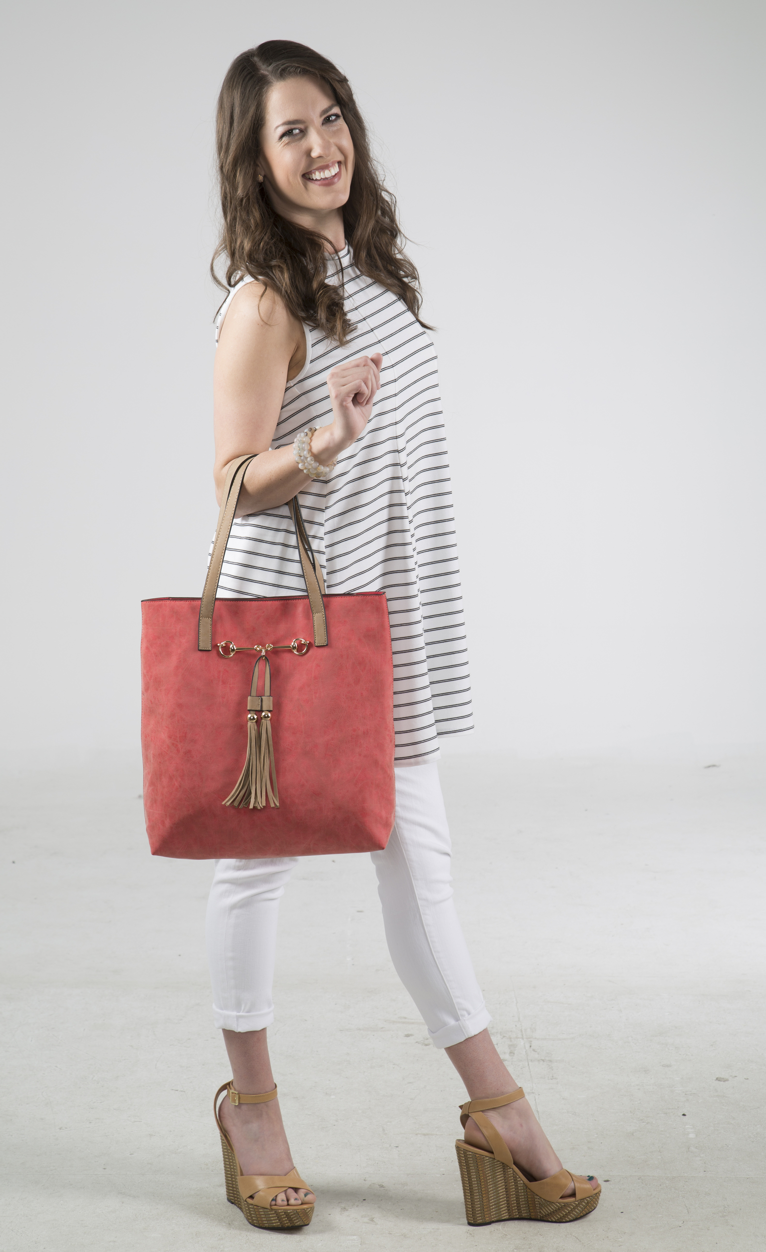 Staff Photo by Dan Henry / The Chattanooga Times Free Press- 4/14/16. Kandace McInturff models one dress styled six ways by Mary Beth Torgerson for Chatter's May travel fashion.