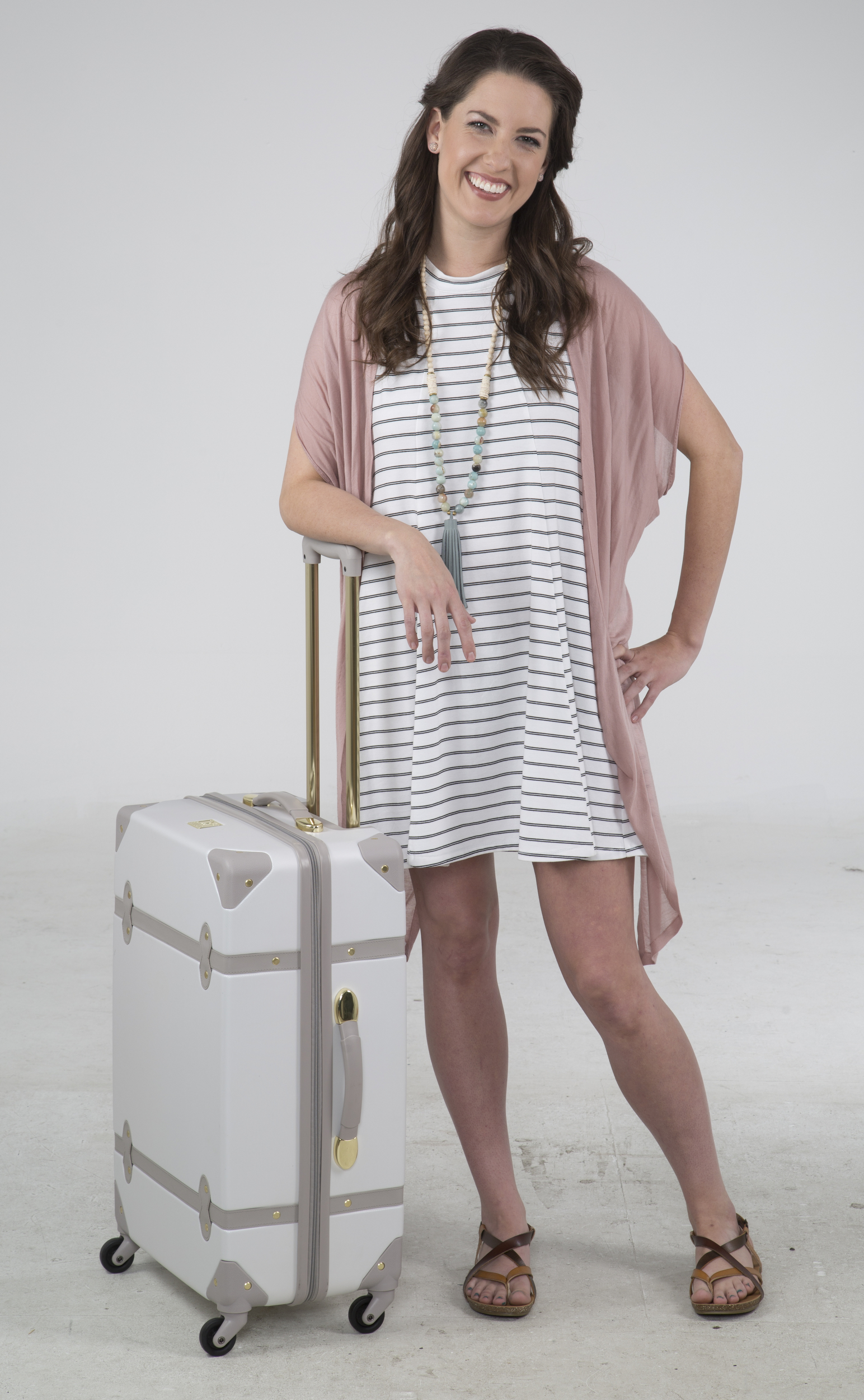 Staff Photo by Dan Henry / The Chattanooga Times Free Press- 4/14/16. Kandace McInturff models one dress styled six ways by Mary Beth Torgerson for Chatter's May travel fashion.