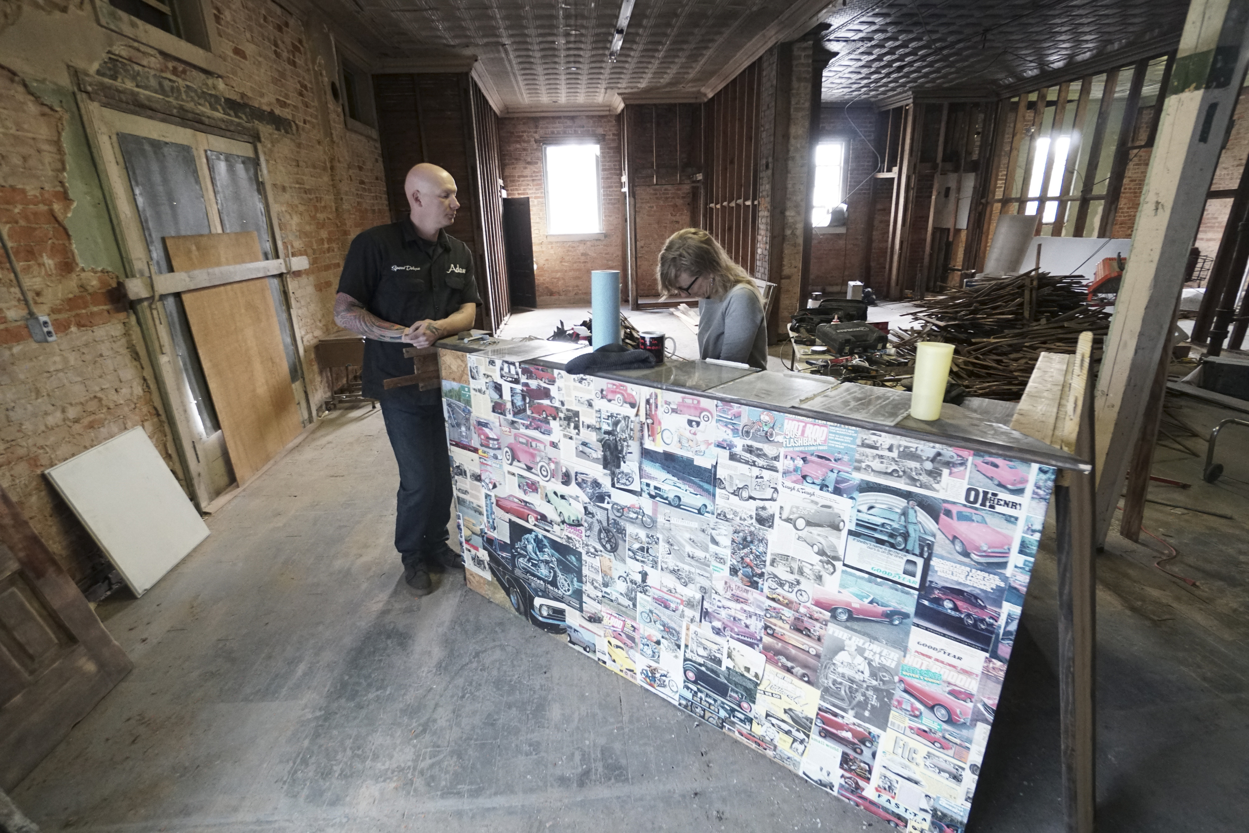 Staff Photo by Dan Henry / The Chattanooga Times Free Press- 3/28/16. Adam Sheard and his wife Jamie, owners of Speed Deluxe, work on building out their shops retail area at the shops new North Chattanooga location off of Cherokee Boulevard on Monday, March 29, 2016.