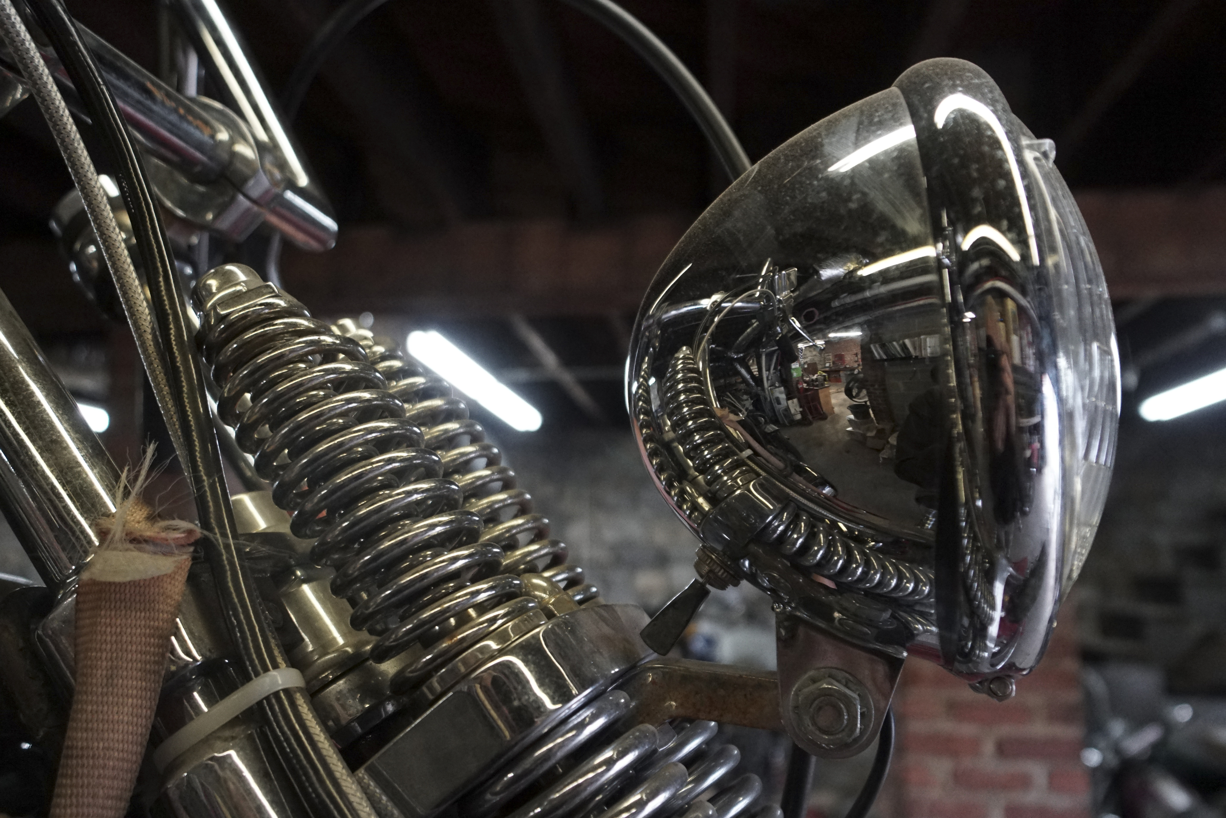 Staff Photo by Dan Henry / The Chattanooga Times Free Press- 3/28/16. Adam Sheard, owner of Speed Deluxe, works on restoring a '54 Pinhead Harley Davidson while at his shops new North Chattanooga location off of Cherokee Boulevard on Monday, March 29, 2016.