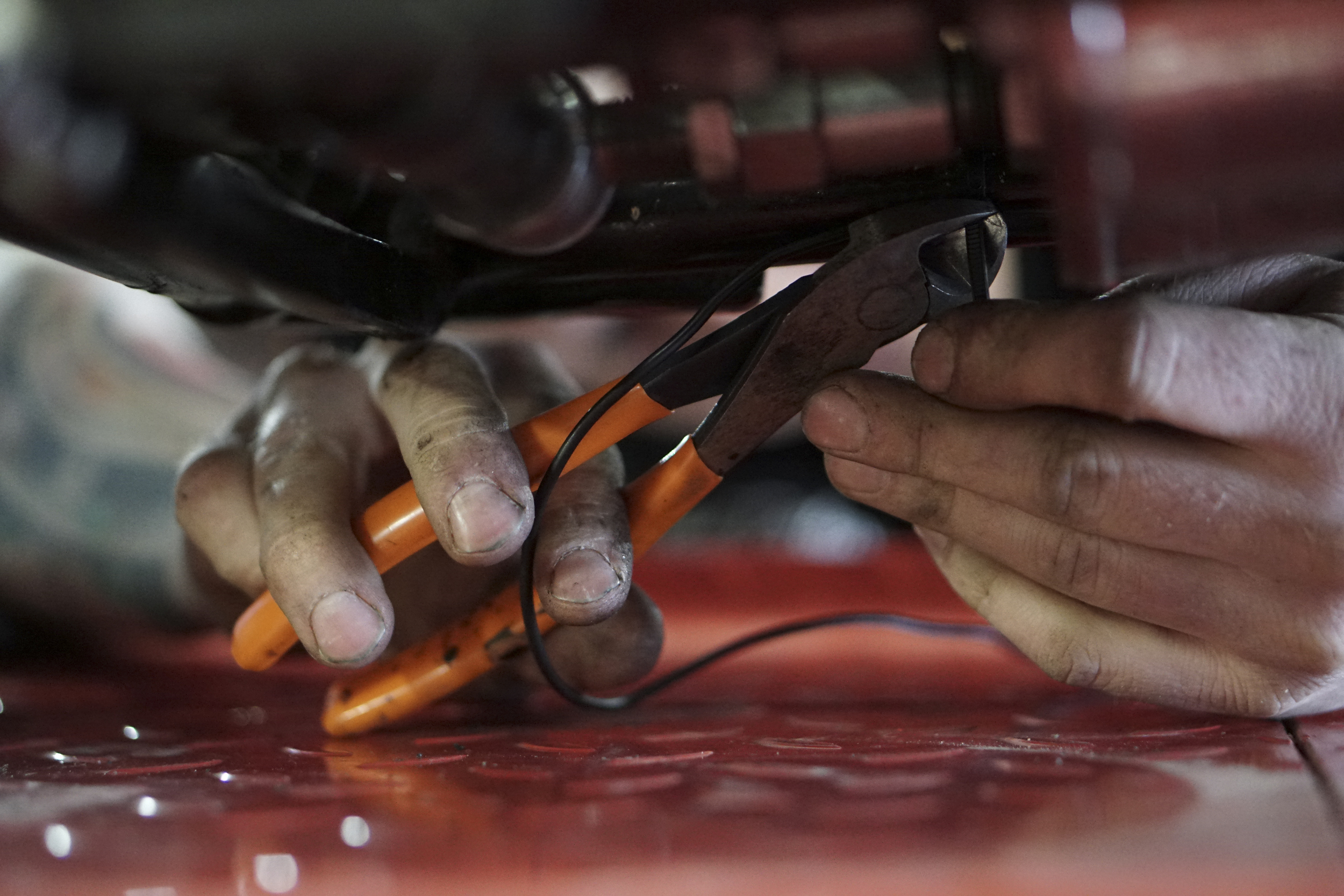 Staff Photo by Dan Henry / The Chattanooga Times Free Press- 3/28/16. Adam Sheard, owner of Speed Deluxe, works on restoring a '54 Pinhead Harley Davidson while at his shops new North Chattanooga location off of Cherokee Boulevard on Monday, March 29, 2016.