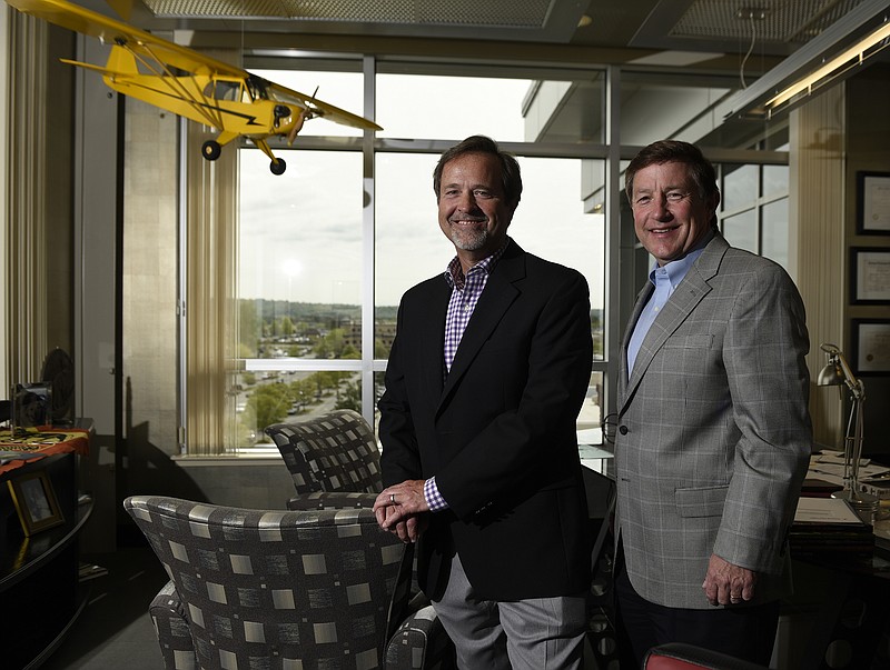 CEO Jay Jolley, left, and president Burt Odom are photographed in the offices of the EMJ Corporation in Chattanooga, Tenn.