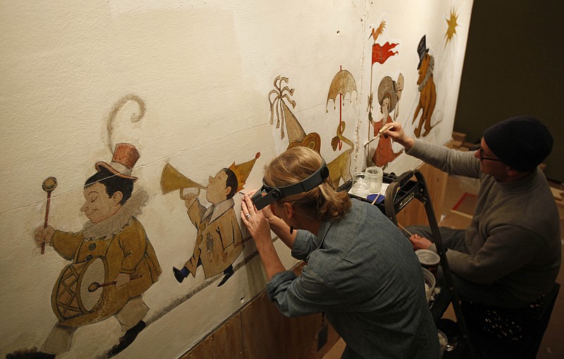 
              FILE - In this Jan. 31, 2011 file photo, mural paintings conservator Cassie Myers and conservation technician Lee Dunsmore with Milner + Carr Conservation LLC perform a conservation treatment on Maurice Sendak's 1961 The Chertoff Mural at the  Rosenbach Museum & Library in Philadelphia.  "The Chertoff Mural" will go on public view starting June 11, 2016. Sendak painted it in 1961 for the children of his friends Lionel and Roslyn Chertoff in their New York City apartment. (AP Photo/Matt Rourke)
            