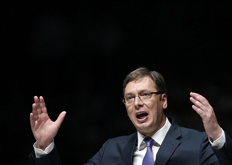 
              In this Thursday, April 21, 2016 photo, Serbian Prime Minister Aleksandar Vucic speaks during a pre-election rally in Novi Sad, Serbia. Serbs vote in a snap election on Sunday that will test Vucic’s proclaimed bid to lead the Balkan nation toward the European Union. Vucic and his Progressive Party are expected to win most votes, but far-right groups favoring close ties with Russia over EU bid have also surged. Radical Party leader Vojislav Seselj is slated to return to Parliament after being recently acquitted of war crimes by a U.N. tribunal. (AP Photo/Darko Vojinovic)
            
