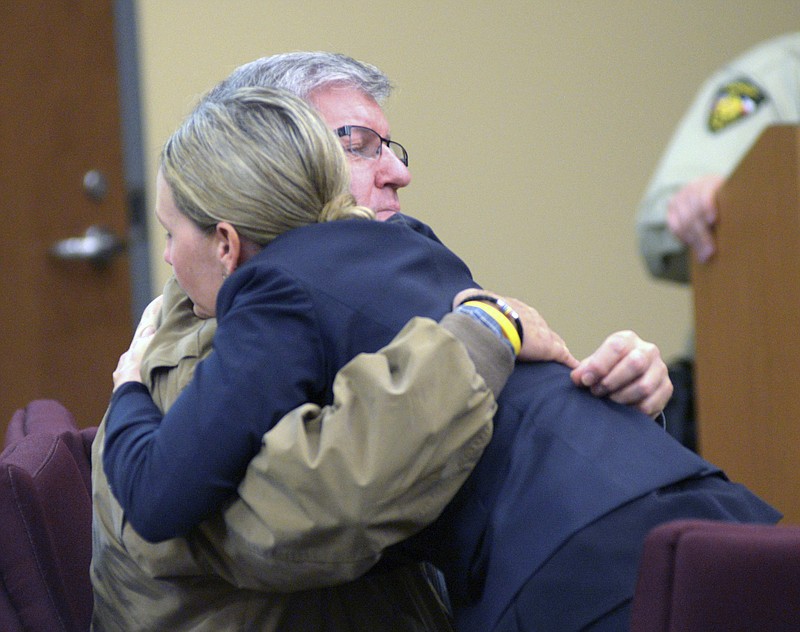 
              Bernie Tiede hugs attorney Jodi Coles during the lunch break after both sides rested Friday, April 22, 2016, at the Rusk County Courthouse in Henderson, Texas. An East Texas jury is now deciding whether, Bernie Tiede, an ex-mortician convicted in the 1996 fatal shooting of Marjorie Nugent, a wealthy widow must return to prison. (Kevin Green/The News-Journal via AP) MANDATORY CREDIT
            