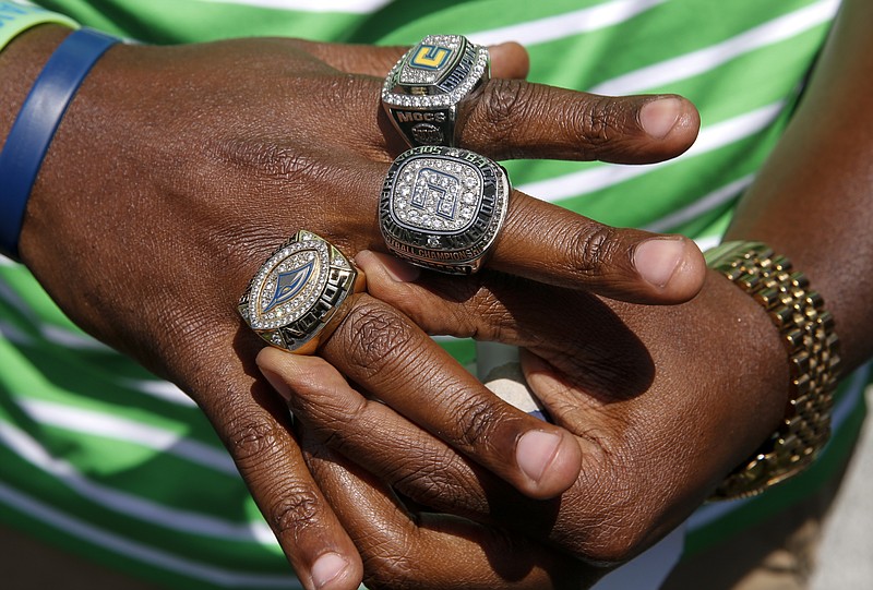 UTC graduate Josh Freeman places his third SoCon ring onto his hand after receiving it at halftime of the UTC spring football game at Finley Stadium on Saturday, April 23, 2016, in Chattanooga, Tenn.