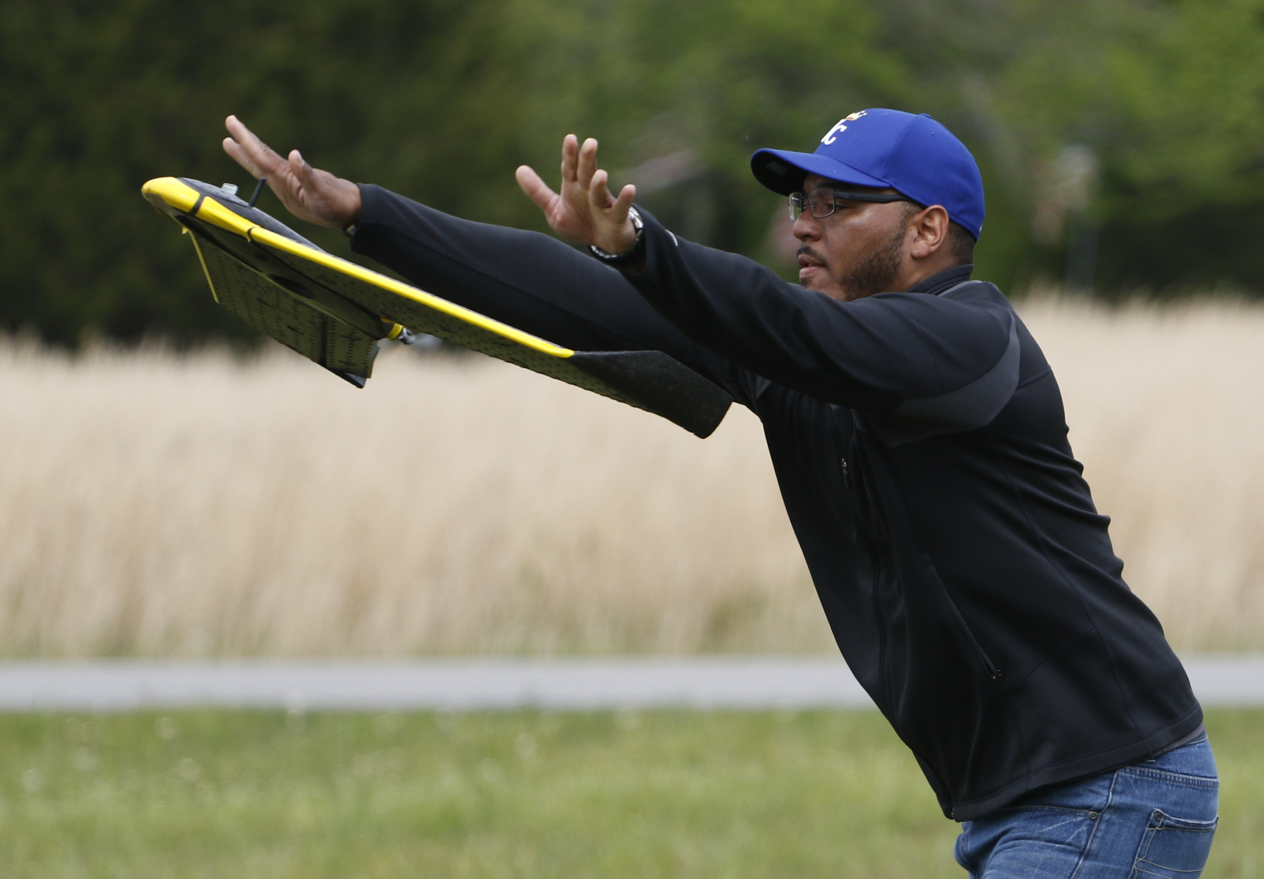 Staff Photo by Dan Henry / The Chattanooga Times Free Press- 4/13/16. Ken Harvey with "enrGies Operations", launches a fixed wing autonomous drone on Wednesday, April 13, 2016 to photograph damage patterns from a tornado that formed two weeks ago near Priceville, Alabama. The team is working in conjunction with the Southeast Vortex Campaign in performing research to support a hypothesis that surface friction and topography play a role in the formation of tornadoes.