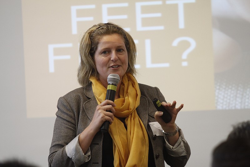 Lucy Beard with the company Feetz speaks during a luncheon Wednesday, July 16, 2014, hosted by the Chattanooga Technology Council at the Business Development Center in Chattanooga, Tenn. Three GigTank teams presented startup ideas at the luncheon related to 3D printers.