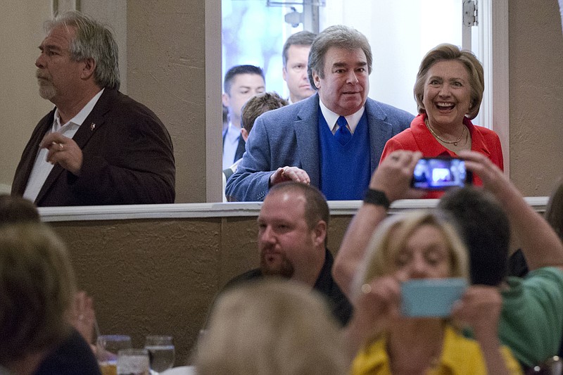 
              In this April 22, 2016, photo, Democratic presidential candidate Hillary Clinton arrives at Casa Bella restaurant accompanied by her brothers Tony Rodham, left, and Hugh Rodham in Scranton, Pa. Everywhere Clinton goes lately, it seems, amounts to a homecoming of sorts. (AP Photo/Matt Rourke)
            