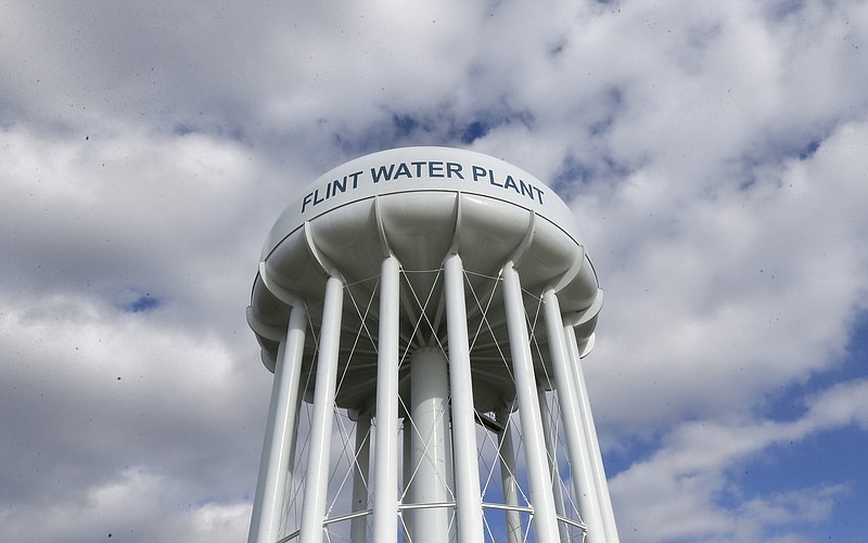 In a March 21, 2016 photo, the Flint Water Plant water tower stands in Flint, Mich., where residents were exposed to high levels of lead in their tap water. (AP Photo/Carlos Osorio)