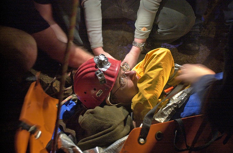 Deborah Jones is secured for transport as part of a simulated cave rescue.