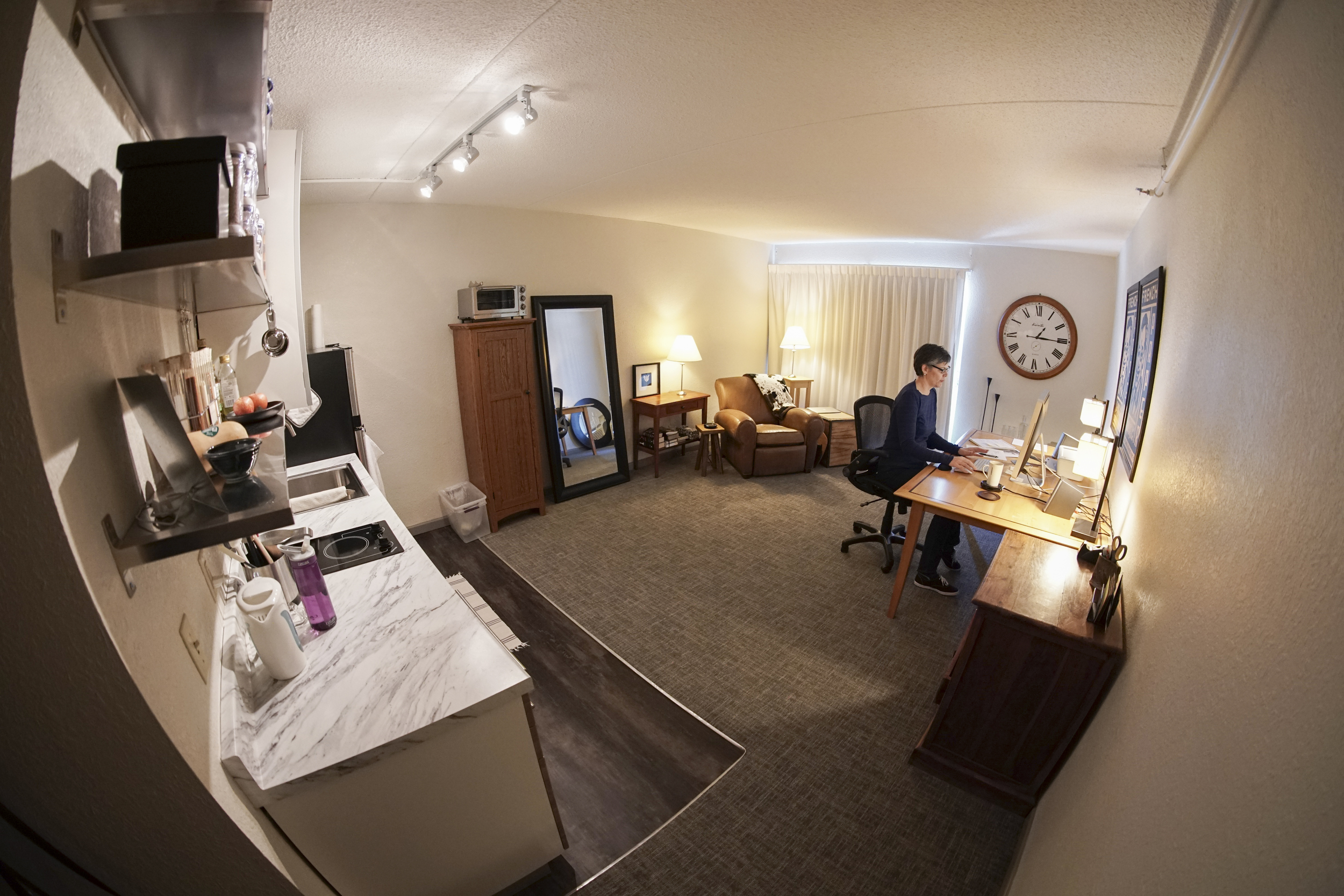 Carol Loree works out of her small one-bedroom apartment in Passenger Flats.