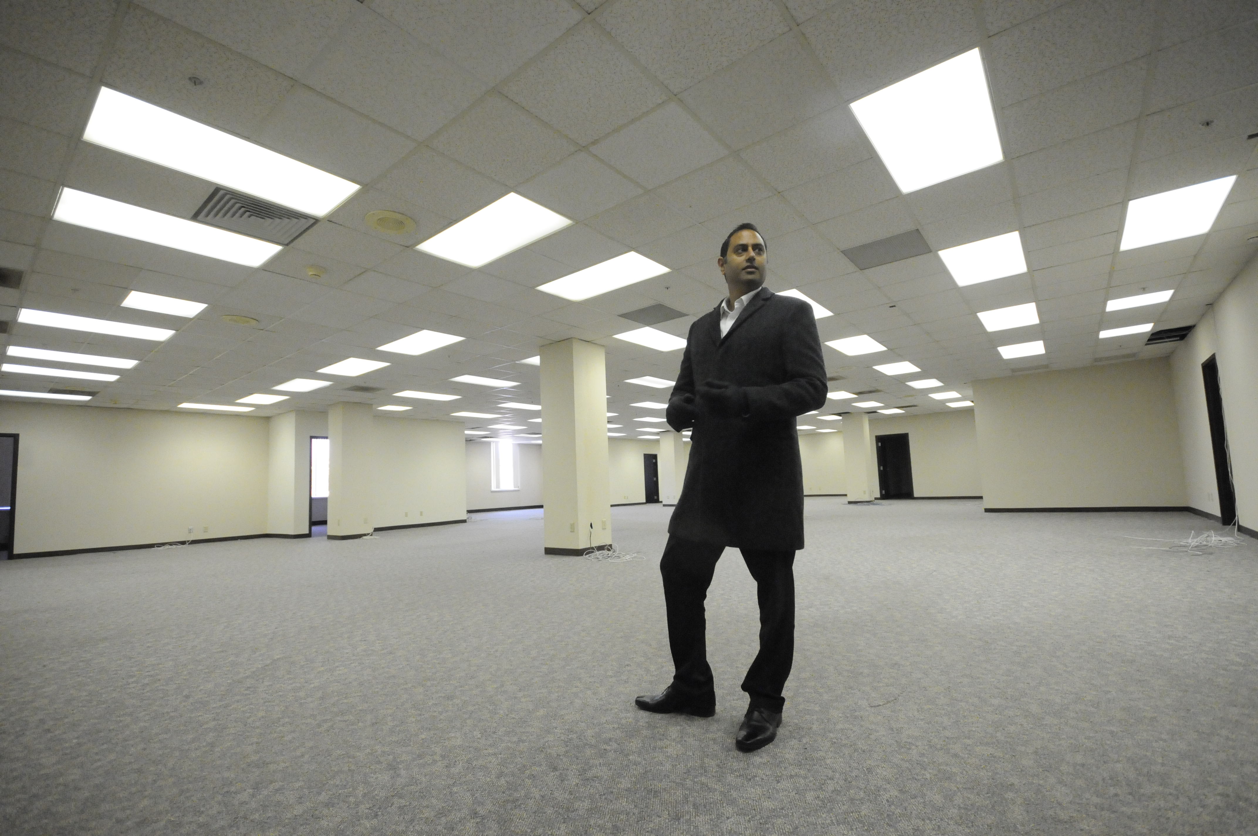 Vic Desai, principal at ViaNova Development, stands on the sixth floor of The Clemons Bro. building at 730 Chestnut St., in November 2014, just prior to the start of construction to retrofit the 100-year-old building for 54 urban loft-style apartments.