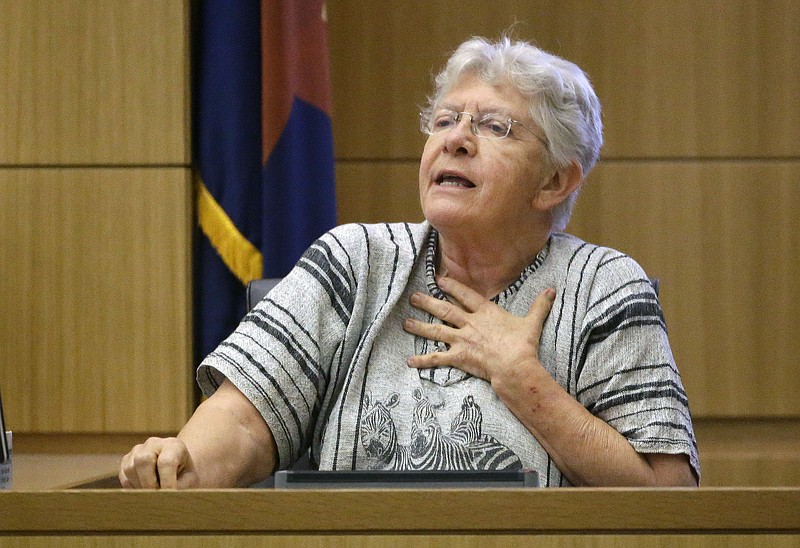 
              CORRECTS FROM DIANE TO DIANNE- Dianne Post, a poll worker in Phoenix testifies about voting problems with Democrat ballots during the presidential primary election in Maricopa County Superior Court in Phoenix, Ariz., on Monday, April 25, 2016. John Brakey, from Tucson, Ariz., is challenging the outcome presidential primary election, contending that  long lines in Maricopa County suppressed the vote and statewide voter registrations problems led to illegal vote counts.   (Rob Schumacher/The Arizona Republic via AP, Pool)
            