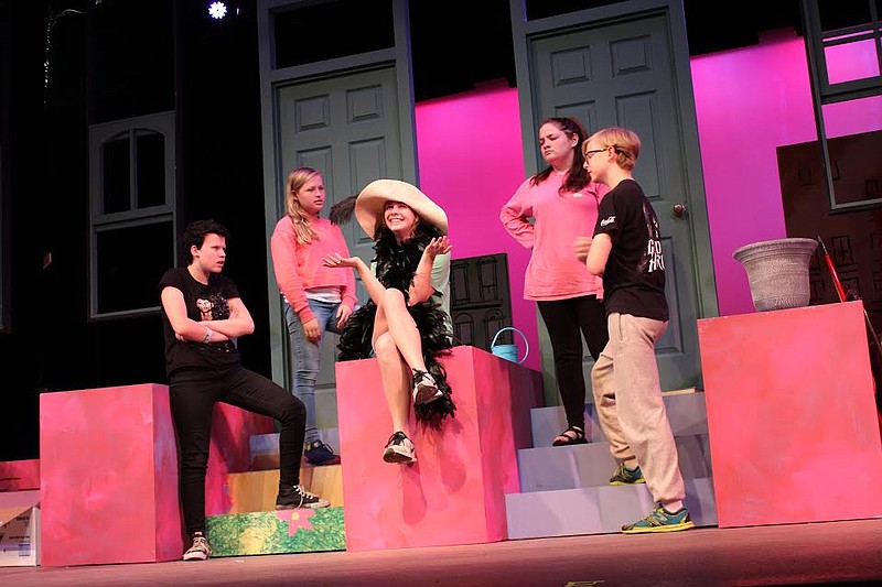 The kids from Avenue P gather on the doorstep to listen while Rosie lives out her fantasy of world fame. The Wild Things cast includes, from left, Savvy Betro-Gross (Alligator), Emma Wesolowski (Kathy), Maggie Meller (Rosie), Hannah Vaughn (Johnny) and Mason Carter (Pierre).