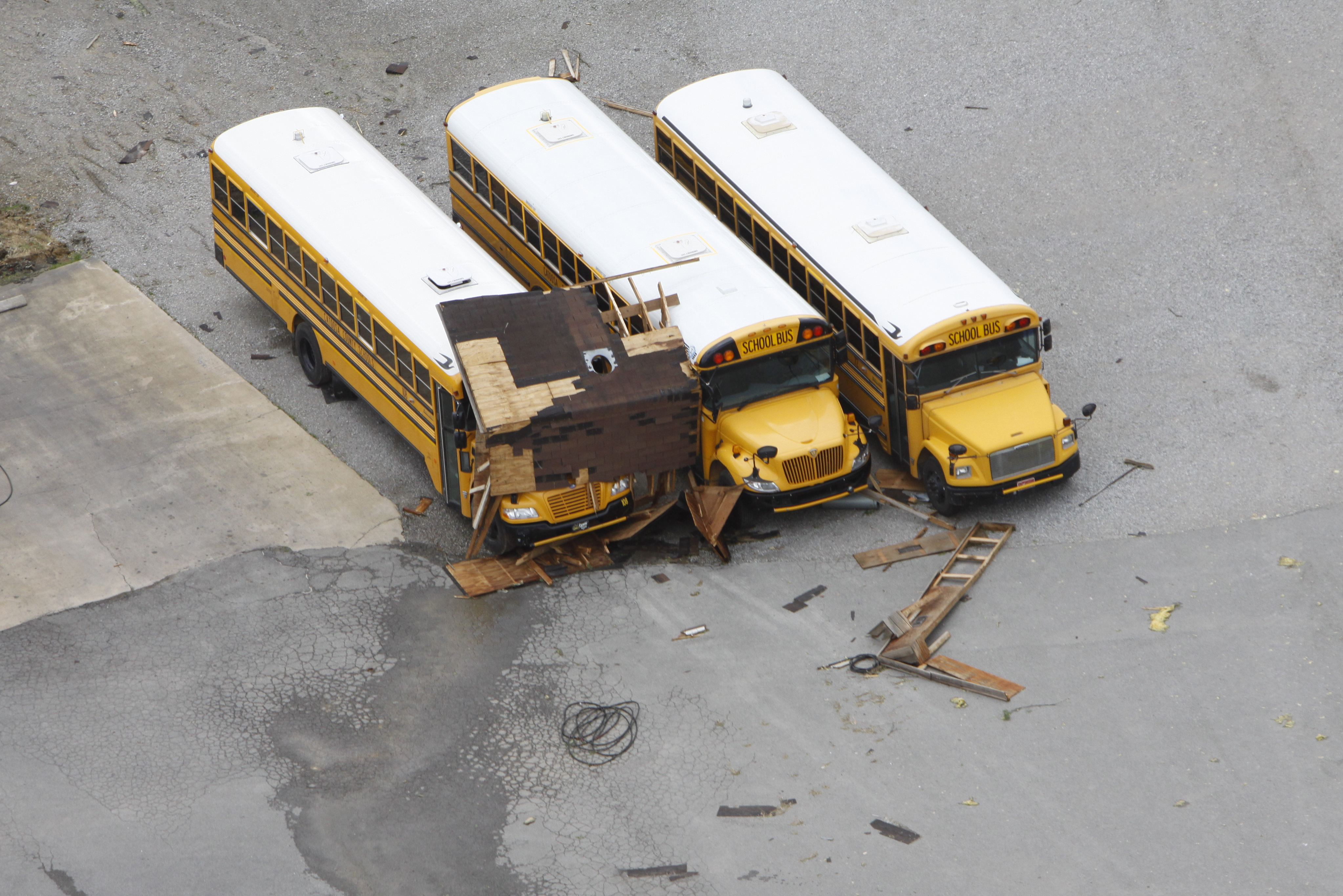 Staff photo by Dan Henry/Chattanooga Times Free Press - April 28, 2011. School busses parked in the Ringgold High School parking lot were damaged after overnight storms produced what is thought to be numerous tornadoes which touched down throughout the North Georgia and Chattanooga area Wednesday evening.