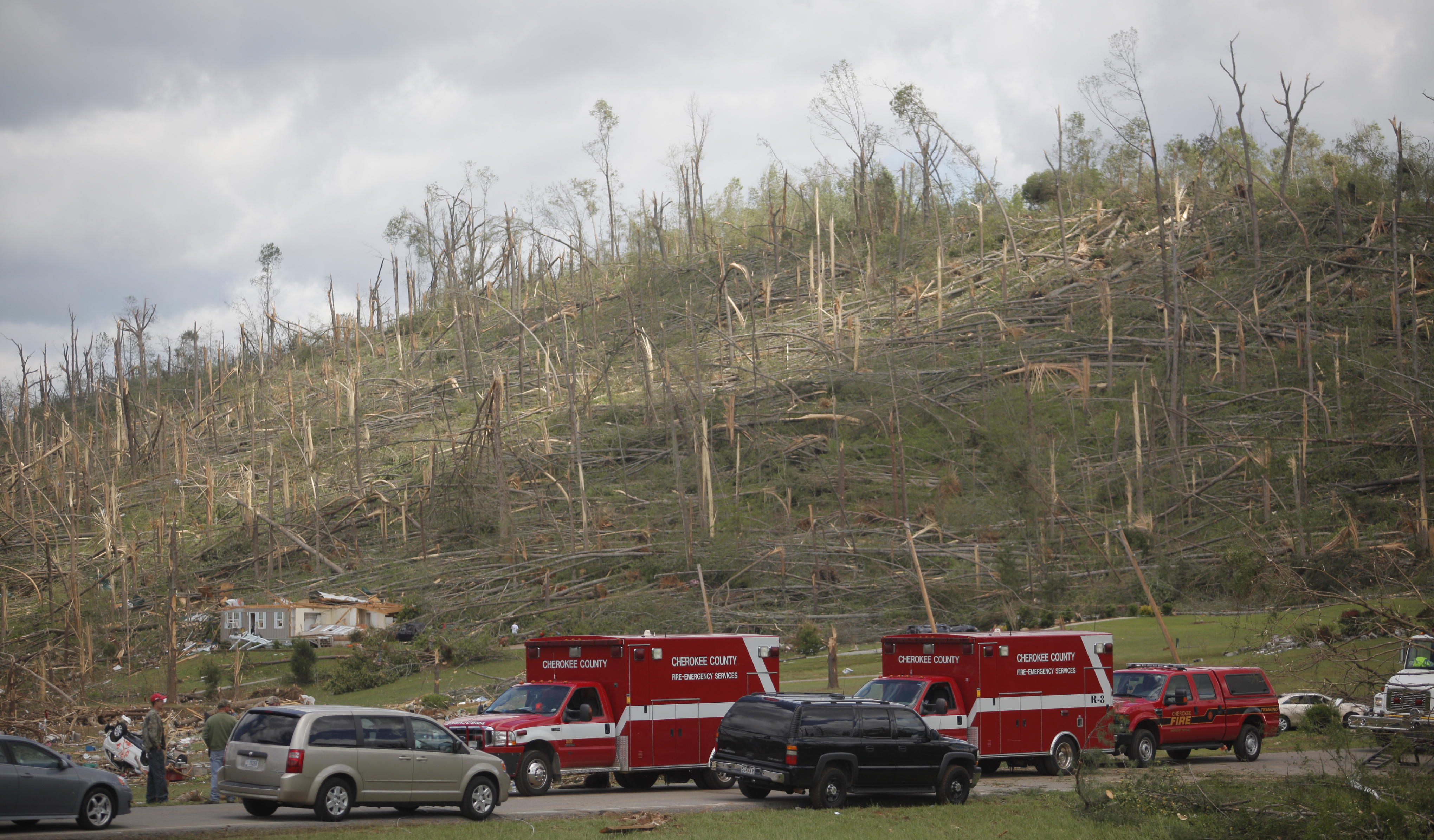 Emergency personnel search through the remnants of a home in Ringgold, Ga., for survivors Thursday. The neighborhood along Cherokee Valley Rd. in Ringgold, Ga., was laid to waste by a tornado Wednesday night.