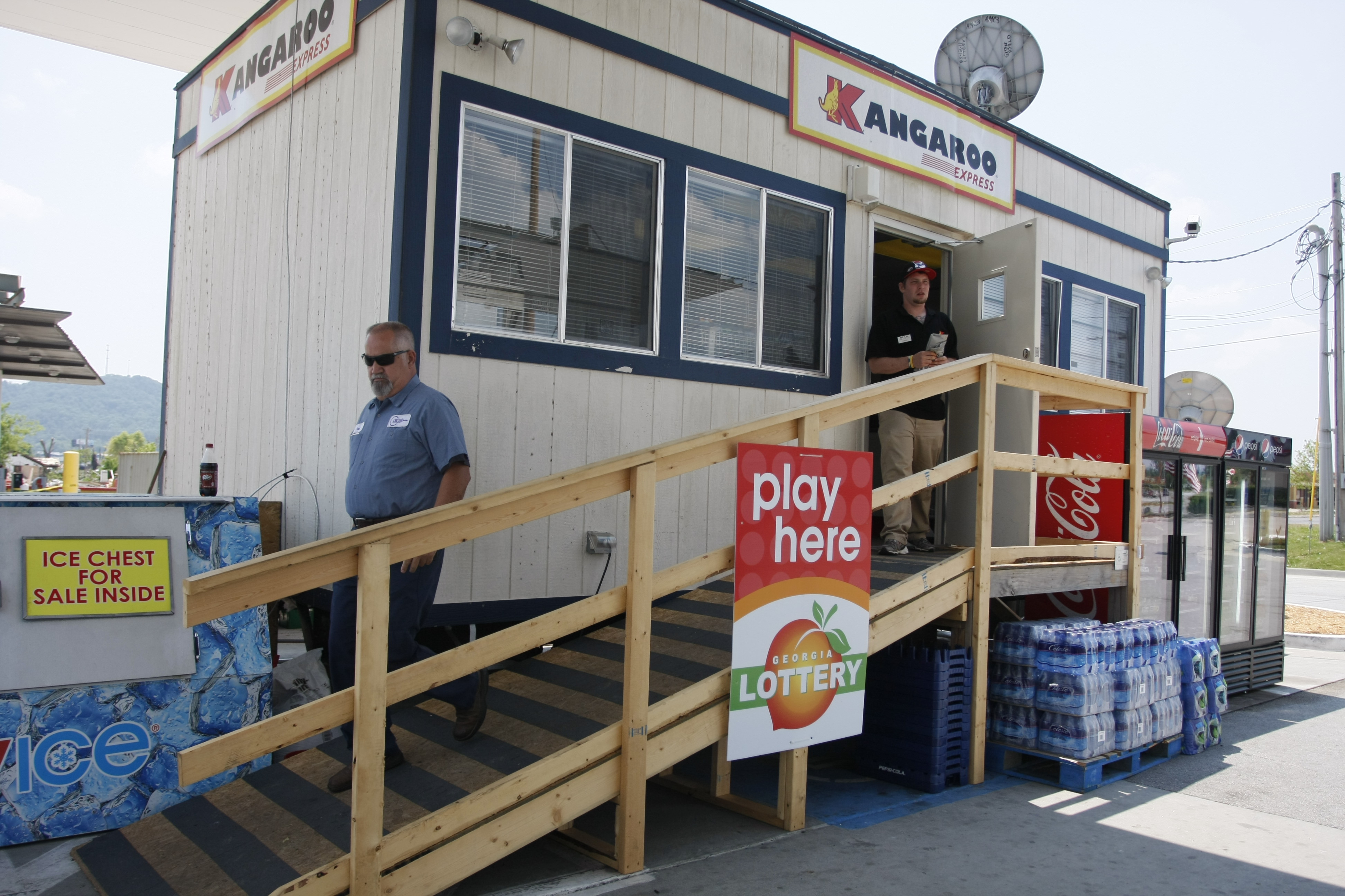 Staff Photo by Allison Carter/Chattanooga Times Free Press - May 31, 2011 - Paul Kaiser (cq), left, and Lance Carter (cq) exit the Kangaroo gas station Monday in Ringgold, Ga. The gas station is operating out of a temporary trailer after April's tornado.