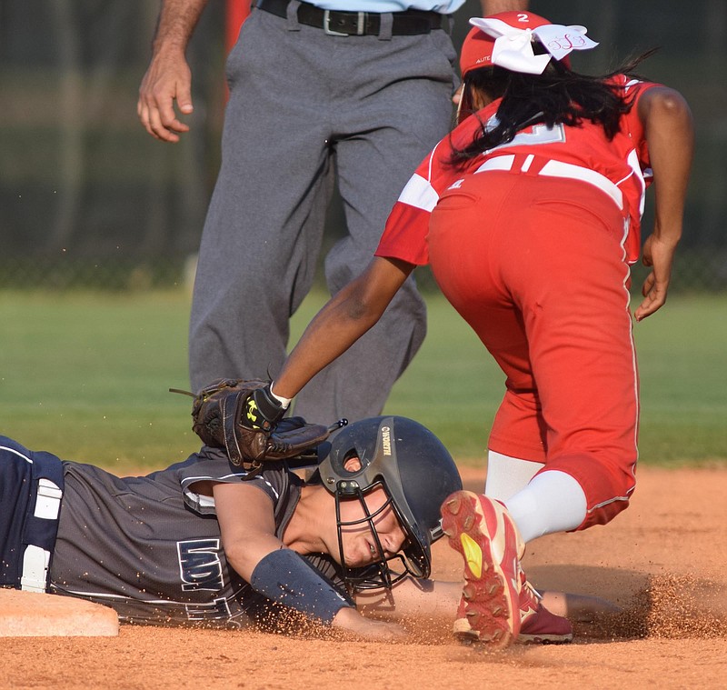 Soddy-Daisy's Meagan Beasley (1) is tagged out trying to steal second by Ooltewah shortstop Tiera Lemon (2).  The Ooltewah Lady Owls hosted the Soddy-Daisy Lady Trojans in TSSAA softball action on Tuesday April 26, 2016.