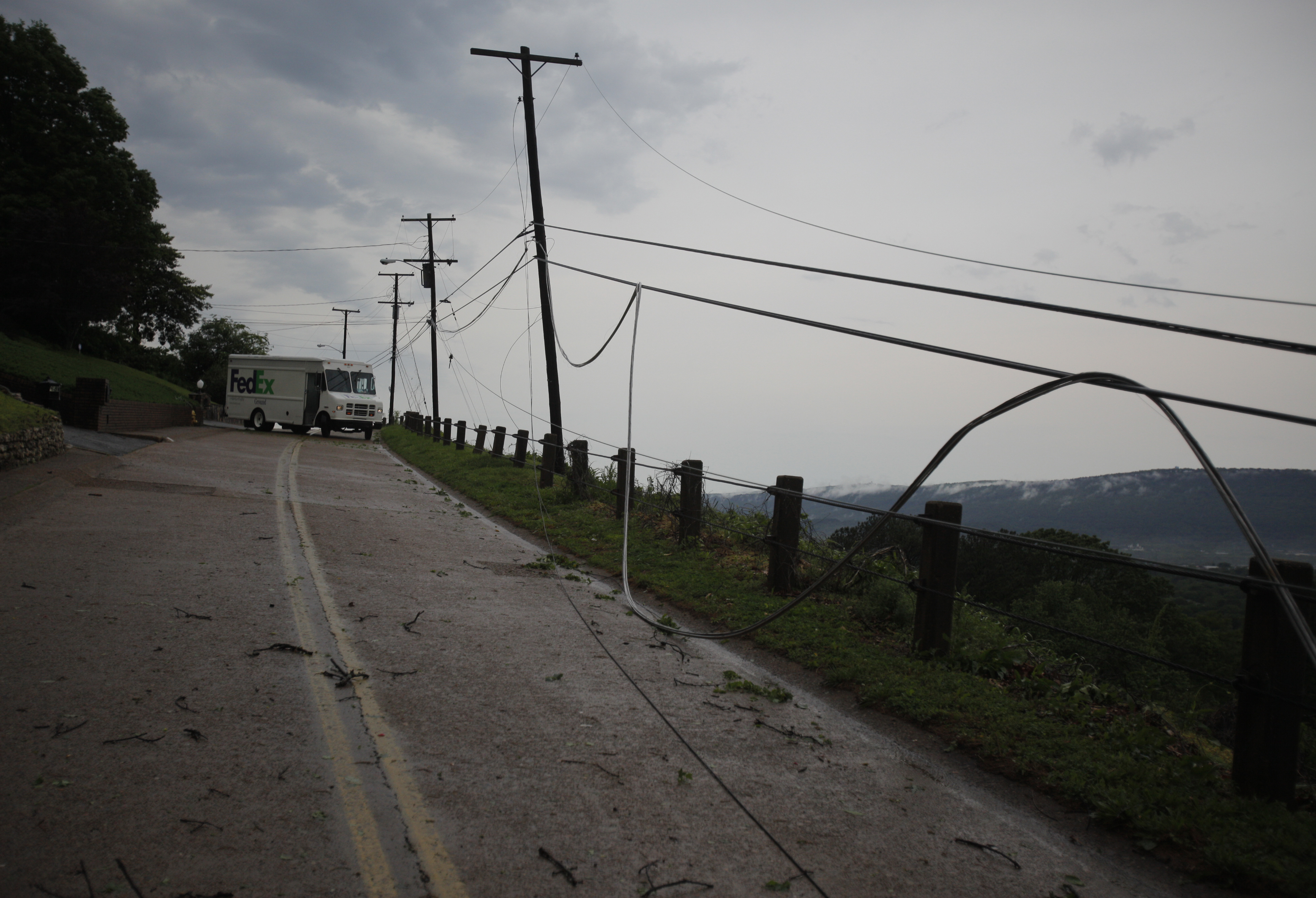 A FedEx van makes a tight turn-around on Crest Road after finding it blocked by a fallen tree. Trees were felled along Missionary Ridge and Main Street during Wednesday morning's storm.