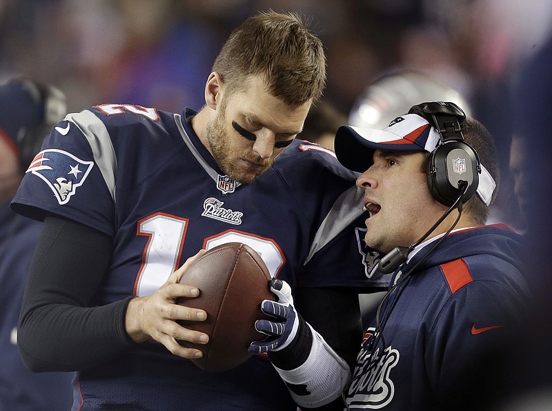 
              FILE - In this Nov. 3, 2013, file photo, New England Patriots offensive coordinator Josh McDaniels, right, talks to quarterback Tom Brady during the fourth quarter of an NFL football game against the Pittsburgh Steelers in Foxborough, Mass. A federal appeals court has ruled, Monday, April 25, 2016,  that New England Patriots Tom Brady must serve a four-game "Deflategate" suspension imposed by the NFL, overturning a lower judge and siding with the league in a battle with the players union. (AP Photo/Steven Senne, File)
            