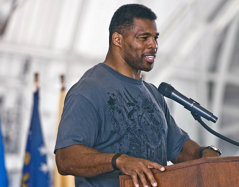 
              FILE - In this March 22, 2012 file photo, former NFL football player Herschel Walker speaks to airmen at Eglin Air Force Base, Fla. Boxing legend Larry Holmes and former football star Herschel Walker are welcoming continued research on the impact of blows from boxing and other sports on the athlete's brain.
The two joined Sen. John McCain of Arizona and Dr. Charles Bernick of the Cleveland Clinic's Lou Ruvo Center for Brain Health on Tuesday, April 26, 2016, at a Capitol Hill news conference. (AP Photo/Northwest Florida Daily News, Mark Kulaw, File)
            