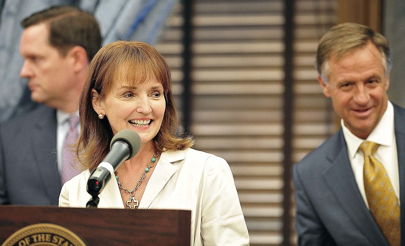 House Speaker Beth Harwell, R-Nashville, center, announces she is creating a task force to propose ways to improve access to health care in Tennessee, Tuesday, April 12, 2016, in Nashville. Harwell said she began conversations with health policy experts at Vanderbilt University's medical school after lawmakers rejected the Insure Tennessee proposal last year by Gov. Bill Haslam, right.