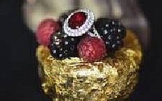 The $90,000 dessert includes a hunk of fondant chocolate caked covered in edible 24K gold topped with gold-dipped strawberries and a sauce of passion fruit and raspberry infused-Cristal champagne. Oh, and that's an antique ruby and diamond ring where a maraschino cherry might normally sit; it costs $85,055.